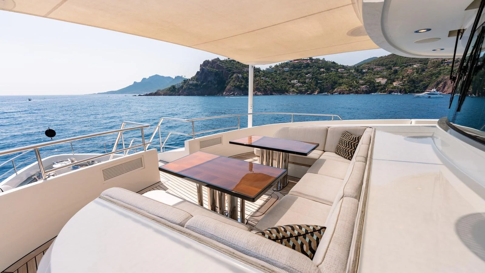 The aft deck offers a luxurious seating area with stunning ocean views. aboard KOKORO Yacht for Sale