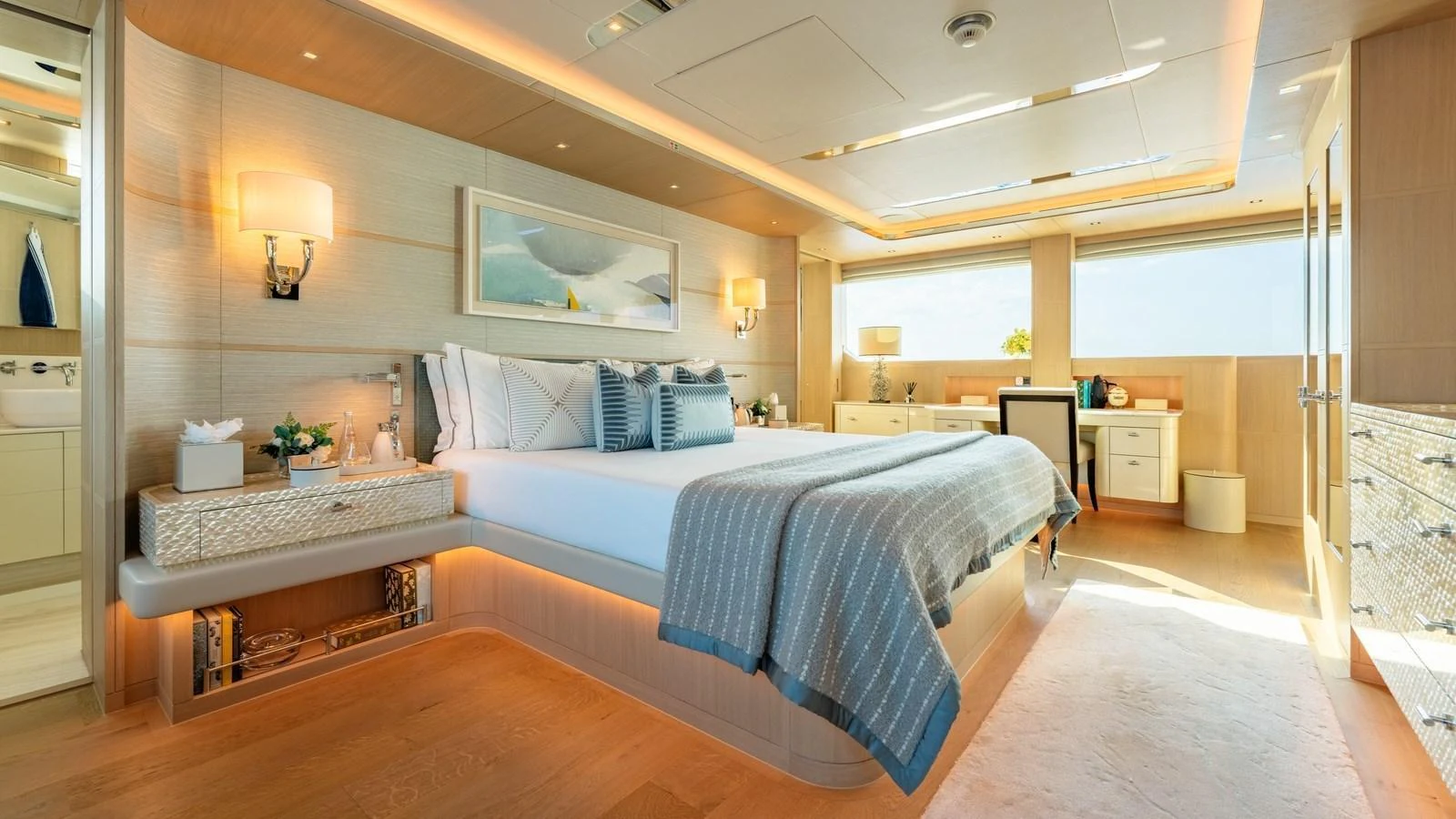 The master stateroom features a luxurious bed, elegant decor, and ample natural light. aboard KOKORO Yacht for Sale