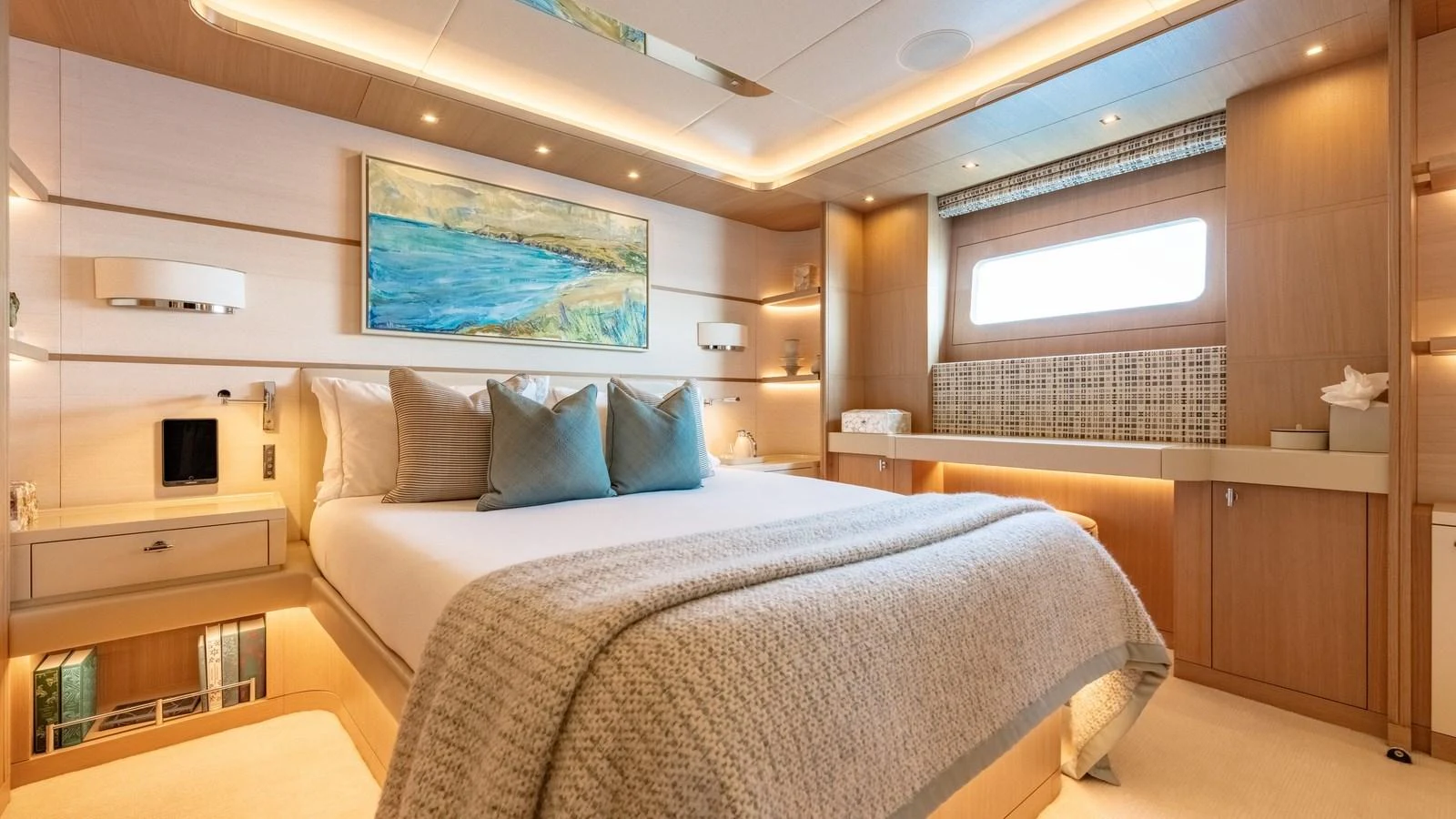 The master stateroom features a luxurious bed with elegant decor and ample natural light. aboard KOKORO Yacht for Sale