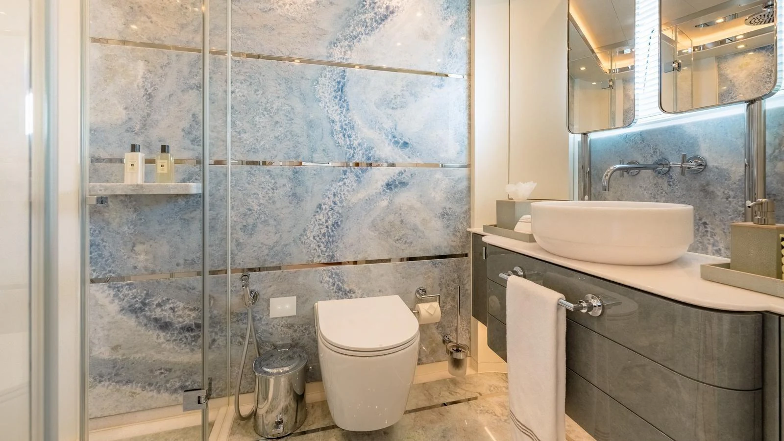 The yacht's bathroom features a modern design with elegant fixtures and a serene ambiance. aboard KOKORO Yacht for Sale