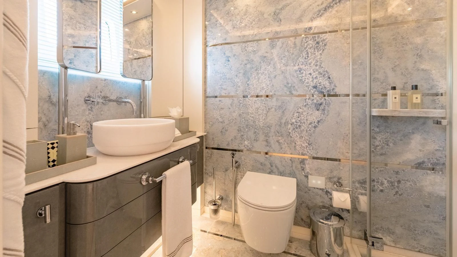 The yacht's bathroom features a modern design with elegant fixtures and a spacious layout. aboard KOKORO Yacht for Sale