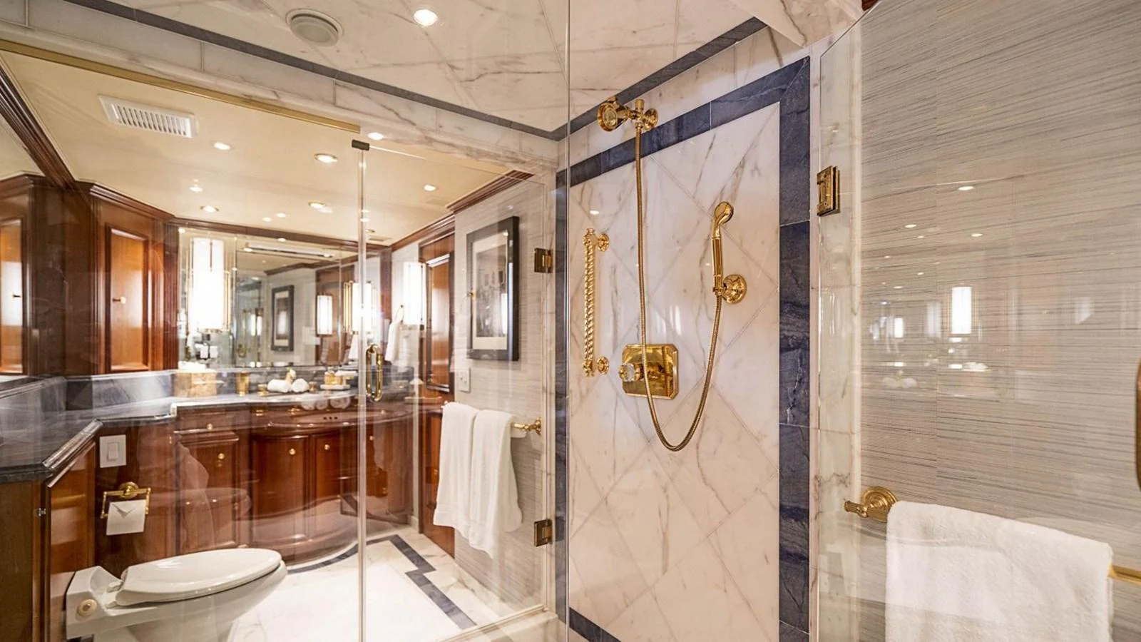The yacht's bathroom features luxurious marble finishes and elegant fixtures. aboard TRUE NORTH Yacht for Sale