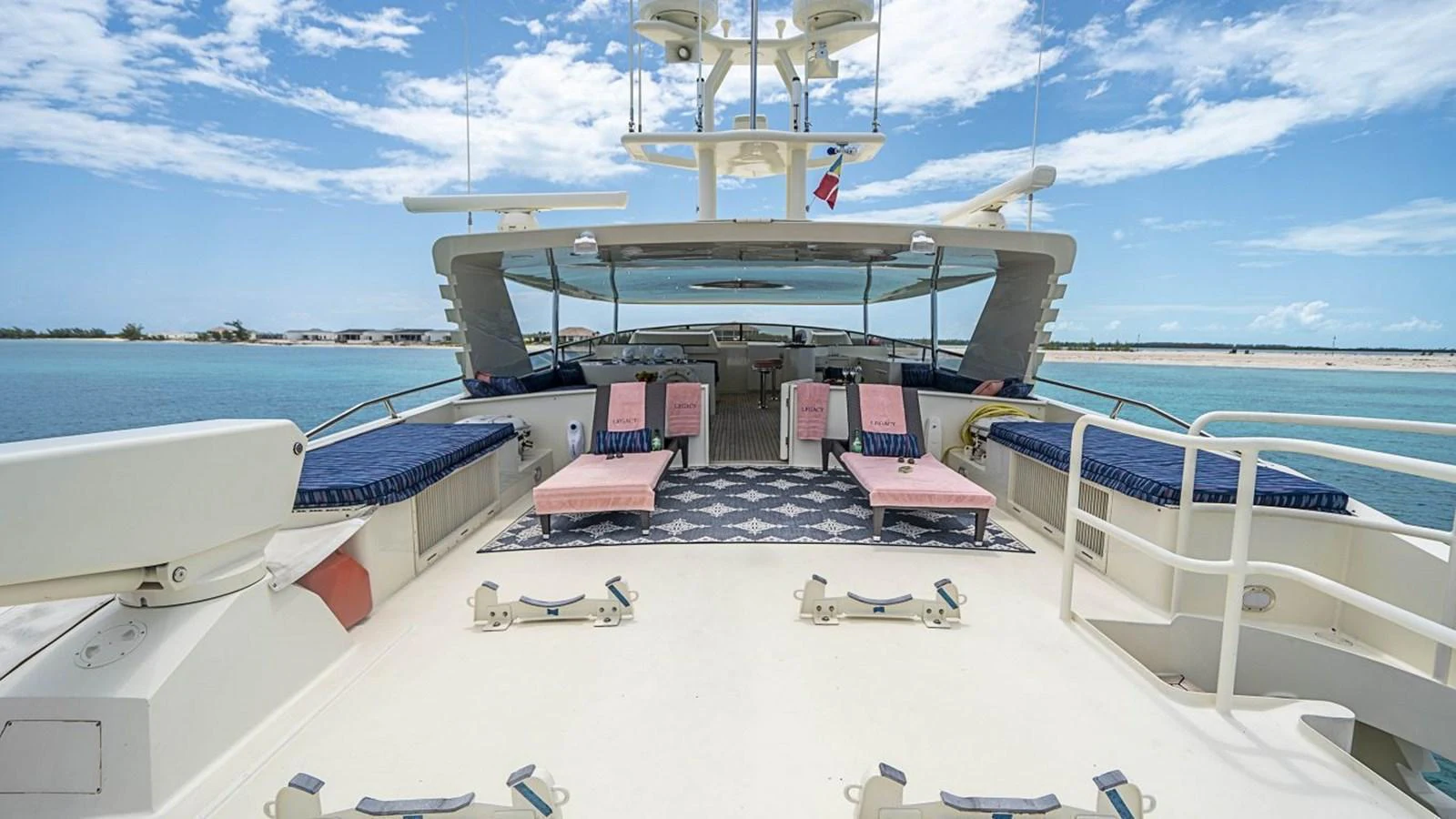 The sundeck offers a spacious and inviting area with comfortable seating and stunning ocean views. aboard TRUE NORTH Yacht for Sale