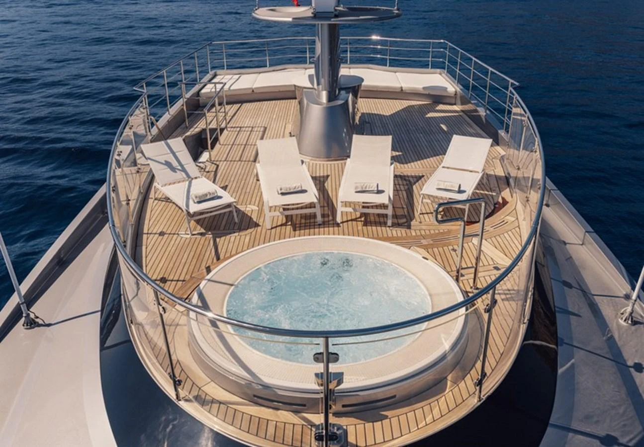 The sundeck features a luxurious jacuzzi surrounded by comfortable sun loungers, perfect for relaxation. aboard ANTALIS Yacht for Sale