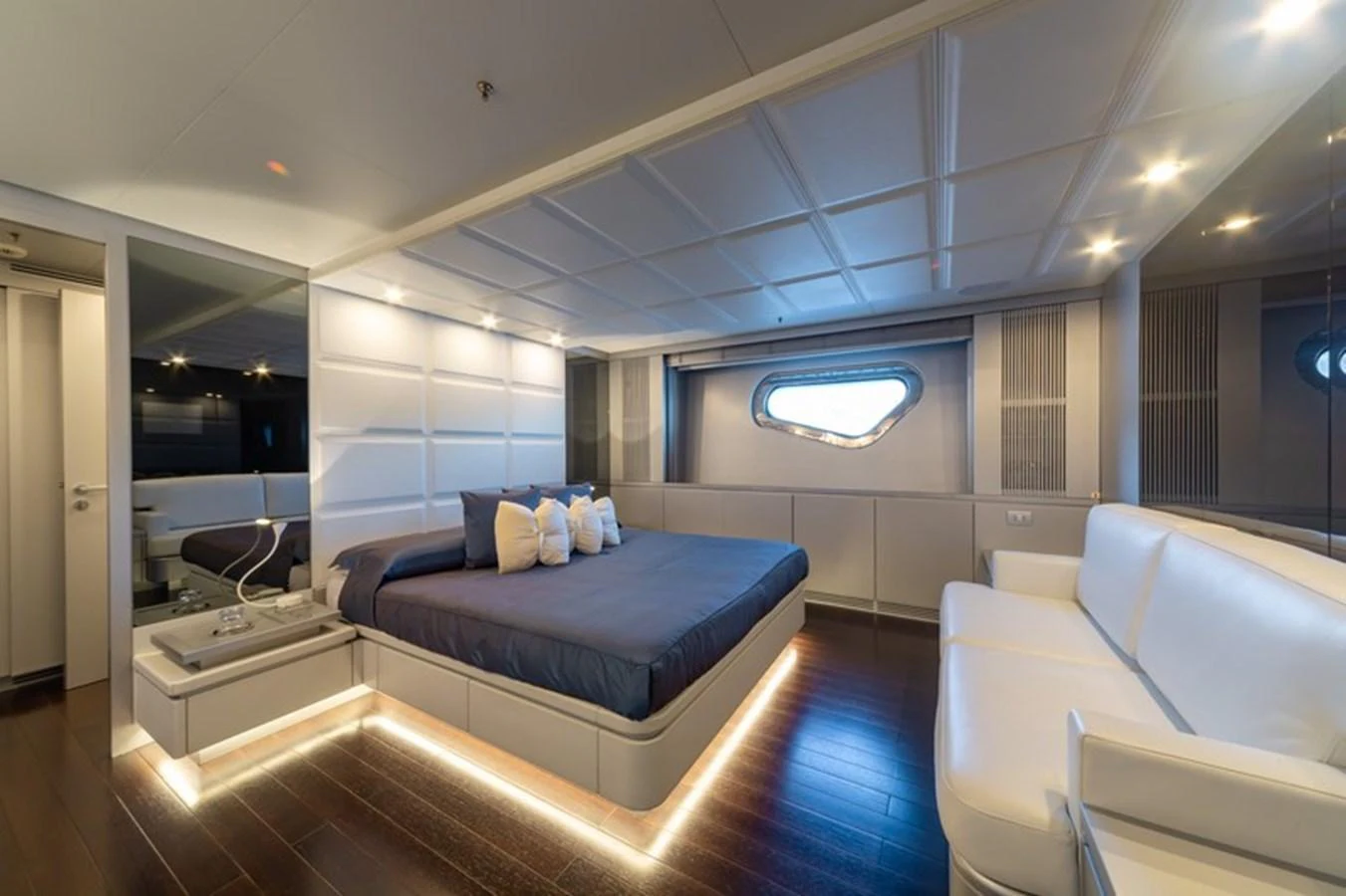 The master stateroom features a luxurious bed, modern lighting, and elegant furnishings. aboard ANTALIS Yacht for Sale