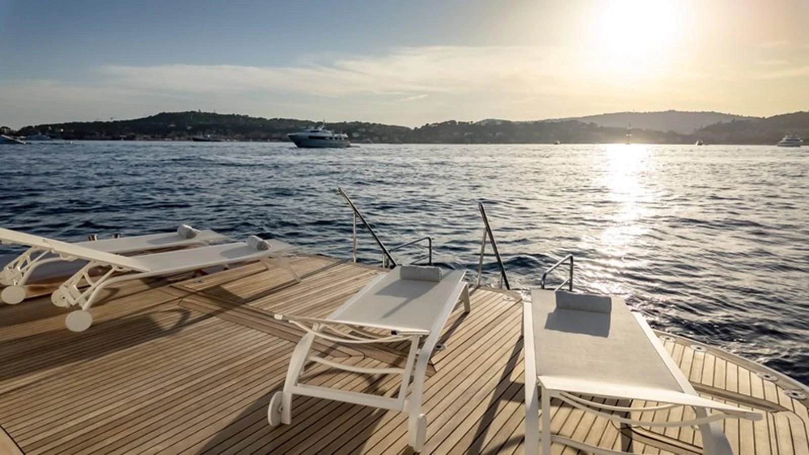 The aft deck features luxurious sun loungers with a stunning view of the water. aboard ANTALIS Yacht for Sale