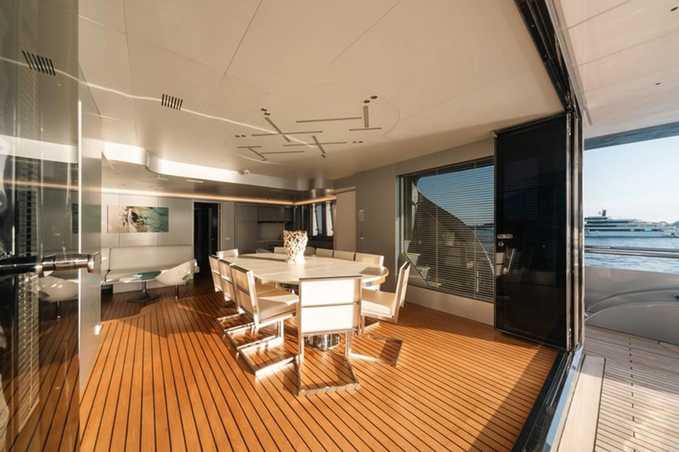 The yacht's dining area features a sleek, modern design with ample natural light and elegant furnishings. aboard ANTALIS Yacht for Sale