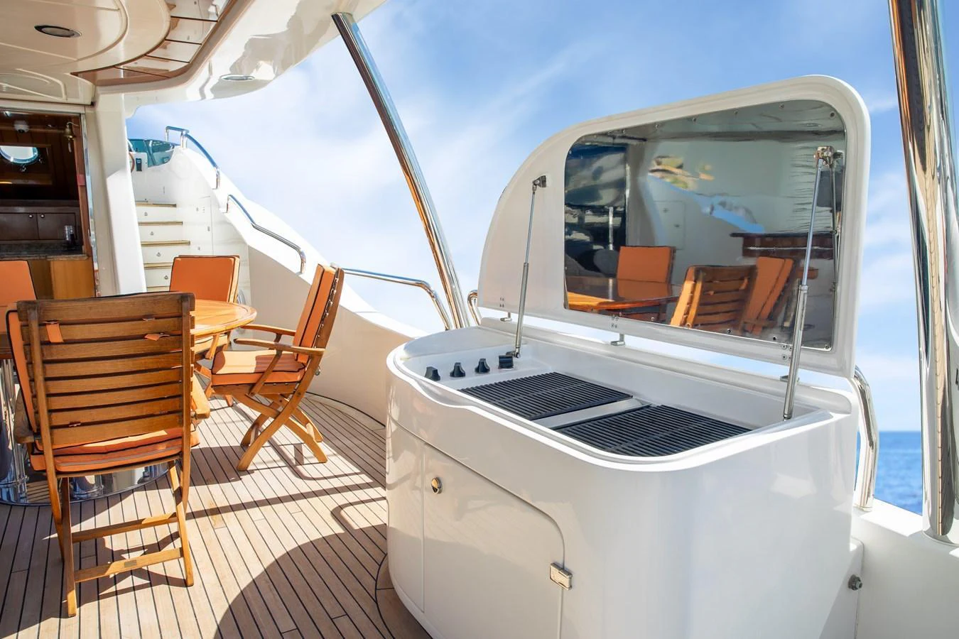 The aft deck features a stylish outdoor dining area with a grill station, perfect for alfresco meals. aboard ANYPA Yacht for Sale