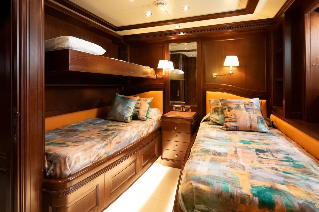 The guest stateroom features twin beds with luxurious bedding and warm wooden finishes. aboard ANYPA Yacht for Sale
