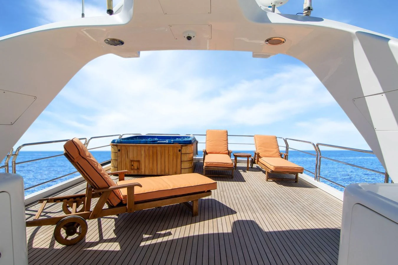 The sundeck features luxurious sun loungers and a hot tub, perfect for relaxation under the open sky. aboard ANYPA Yacht for Sale