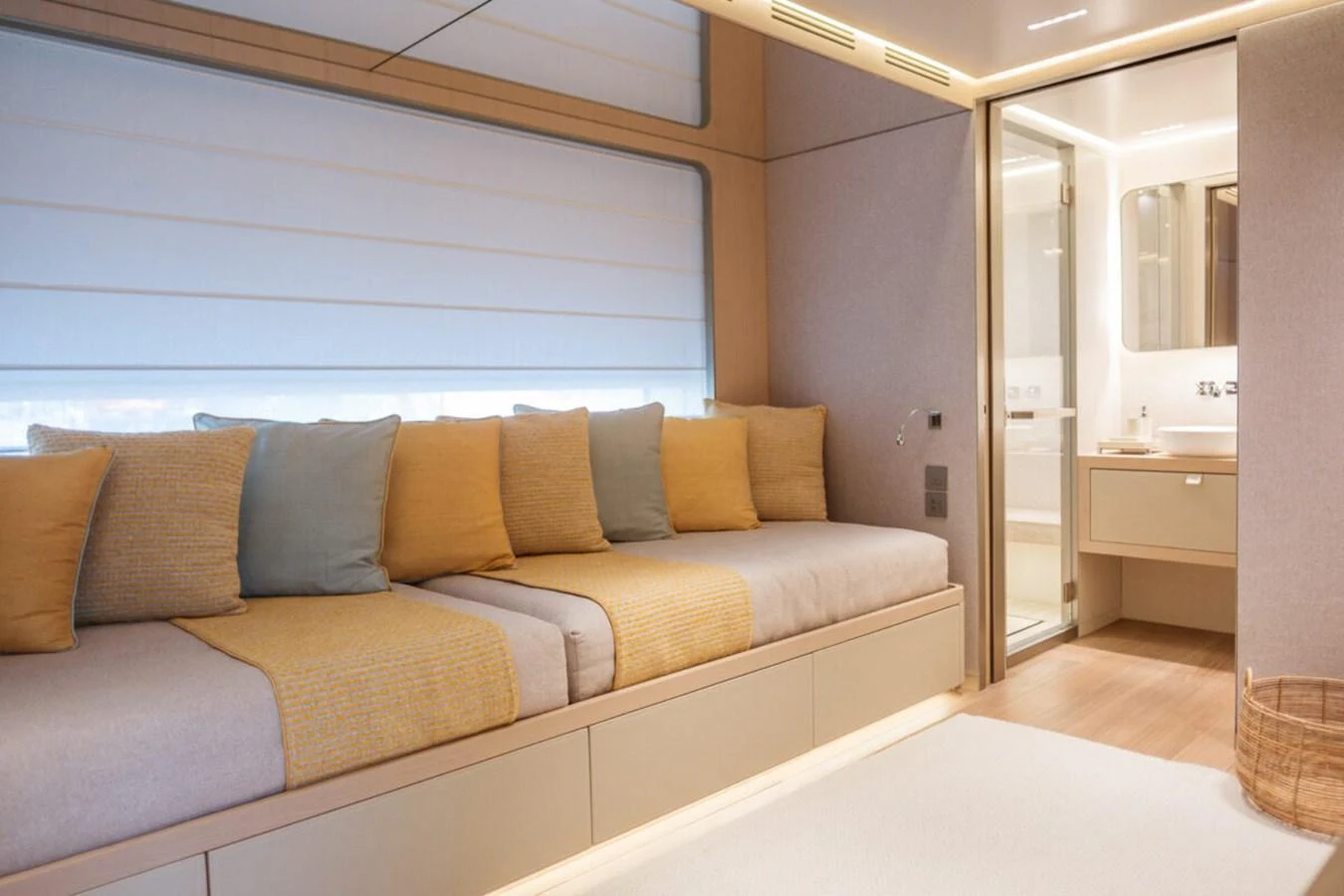 The stateroom features a cozy seating area with plush cushions and a modern ensuite bathroom. aboard TOLEMAI Yacht for Sale