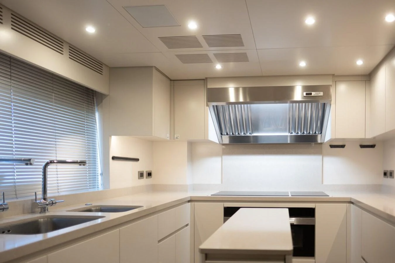 The yacht's galley features modern appliances and a sleek, minimalist design. aboard TOLEMAI Yacht for Sale