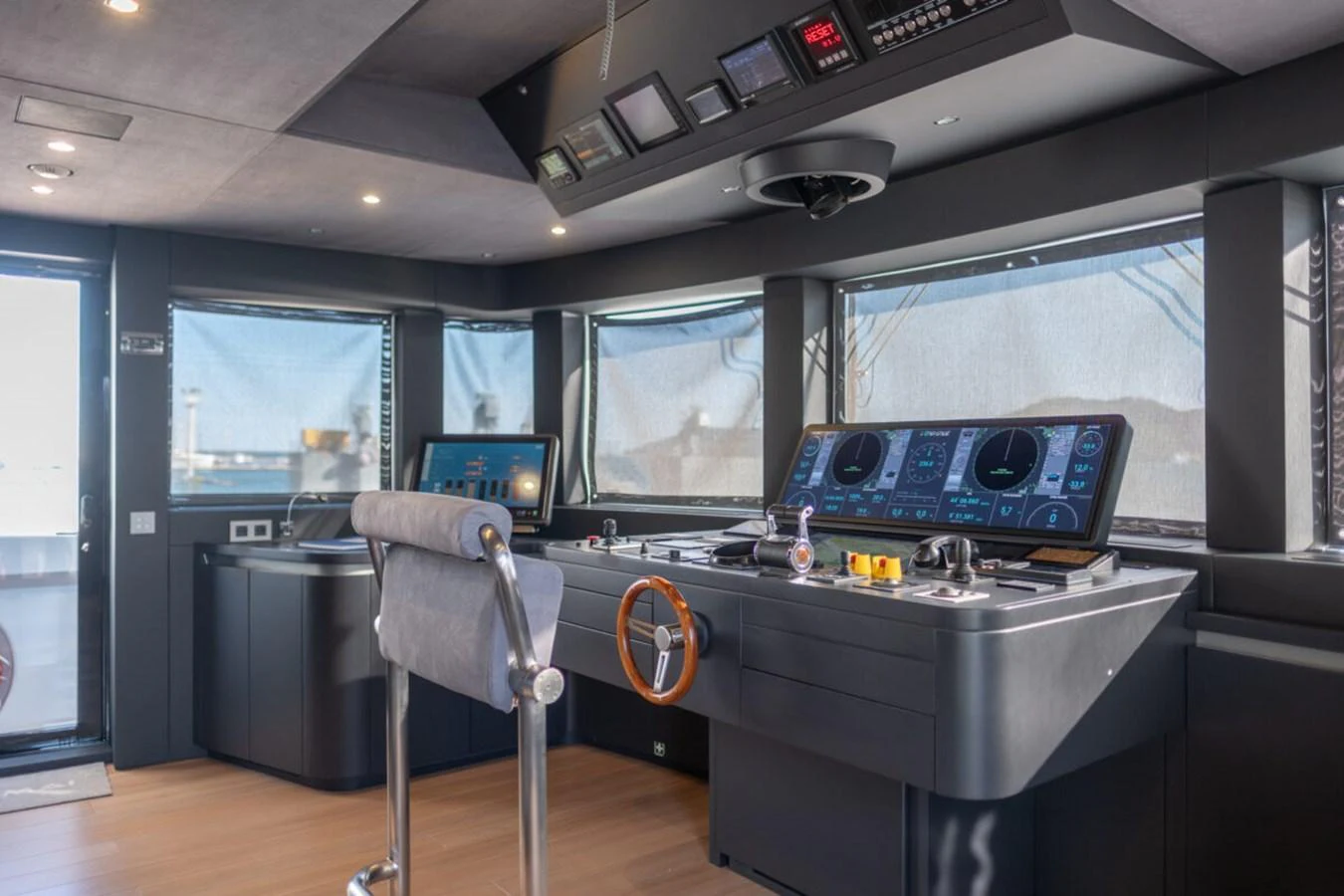 The helm station features advanced navigation equipment and a sleek, modern design. aboard TOLEMAI Yacht for Sale