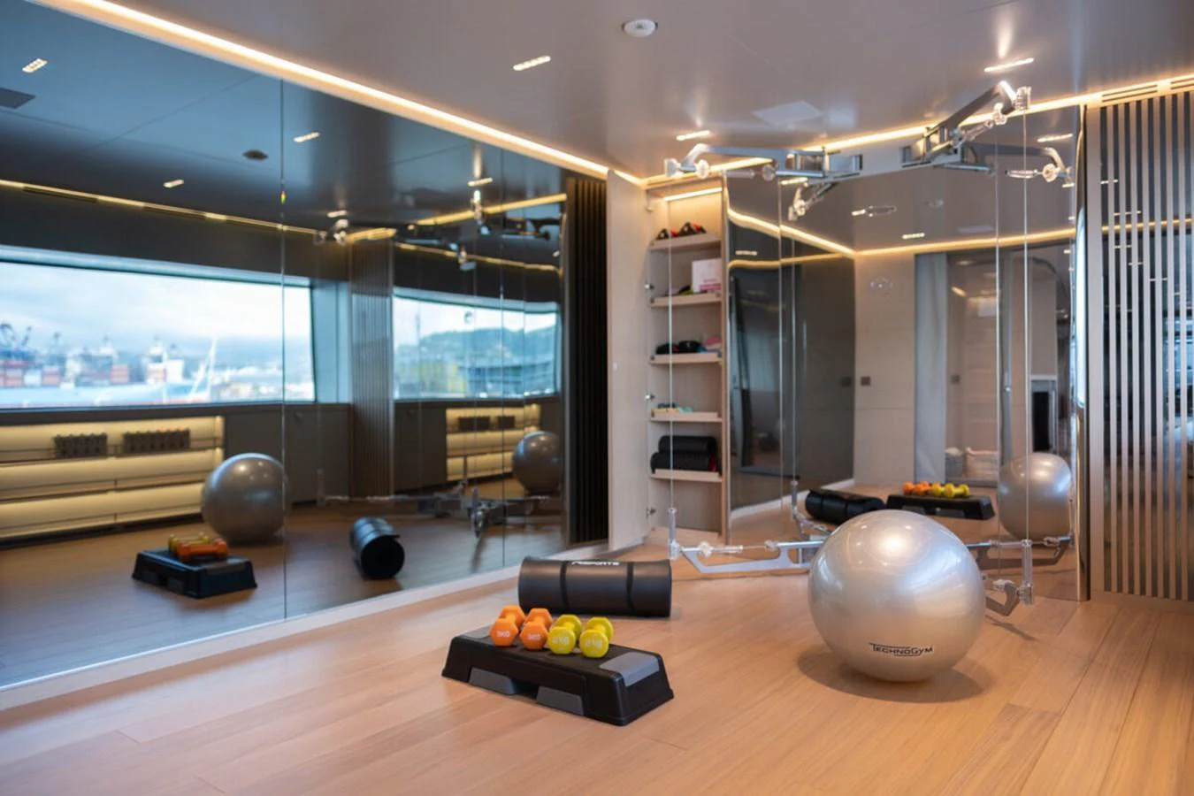 The yacht features a well-equipped gym with modern fitness equipment and ample space for workouts. aboard TOLEMAI Yacht for Sale