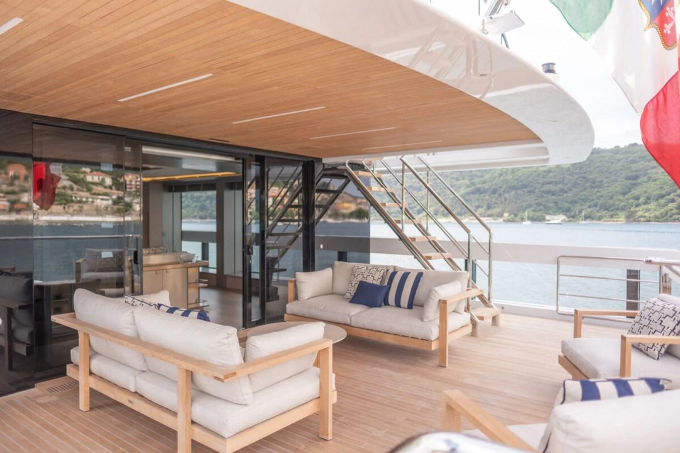 The aft deck features a spacious lounging area with comfortable seating and scenic views. aboard TOLEMAI Yacht for Sale