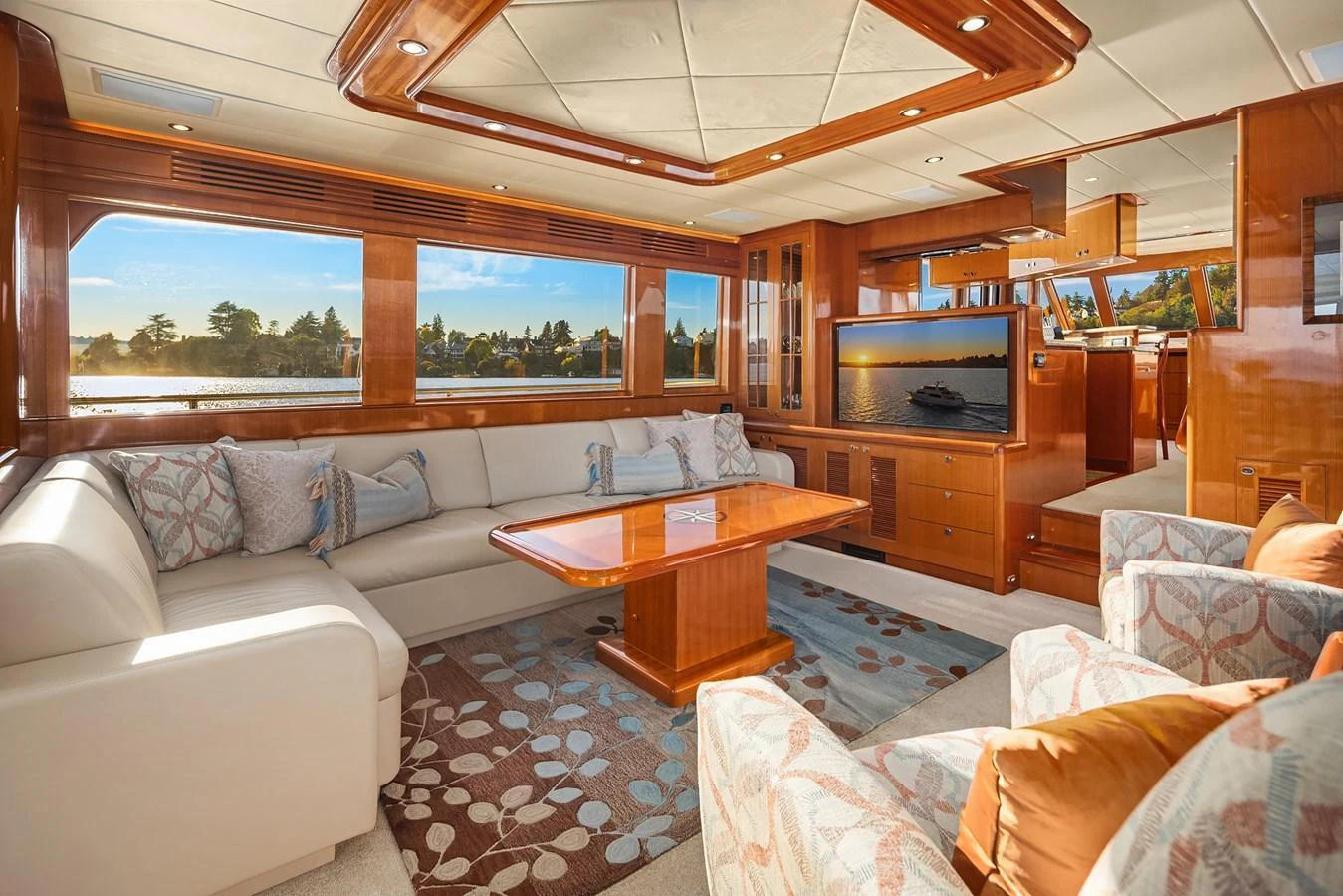 The salon offers a spacious and luxurious seating area with large windows providing stunning views. aboard LA BELLA VITA II Yacht for Sale