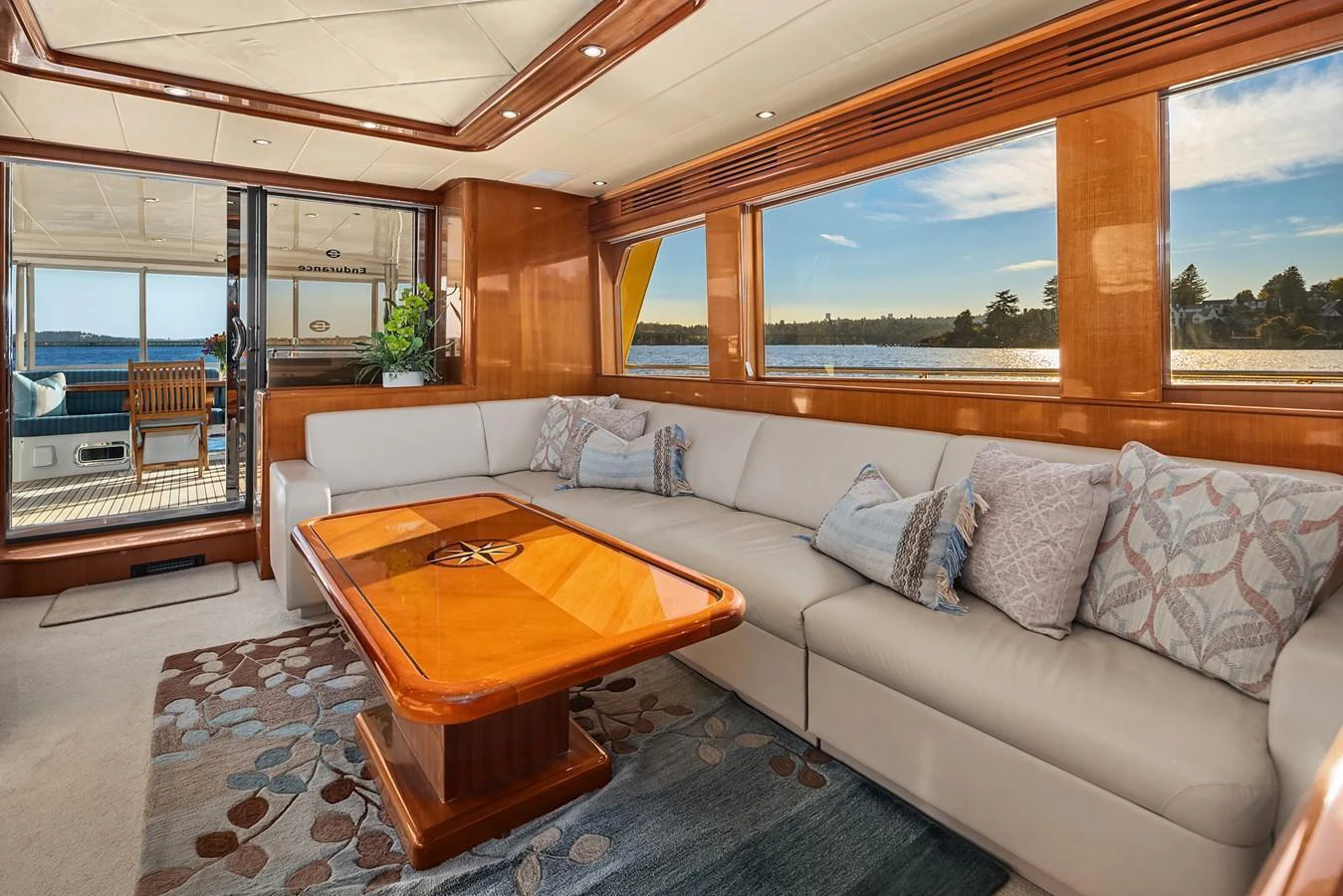 The salon offers a luxurious and comfortable seating area with a stunning view of the water. aboard LA BELLA VITA II Yacht for Sale