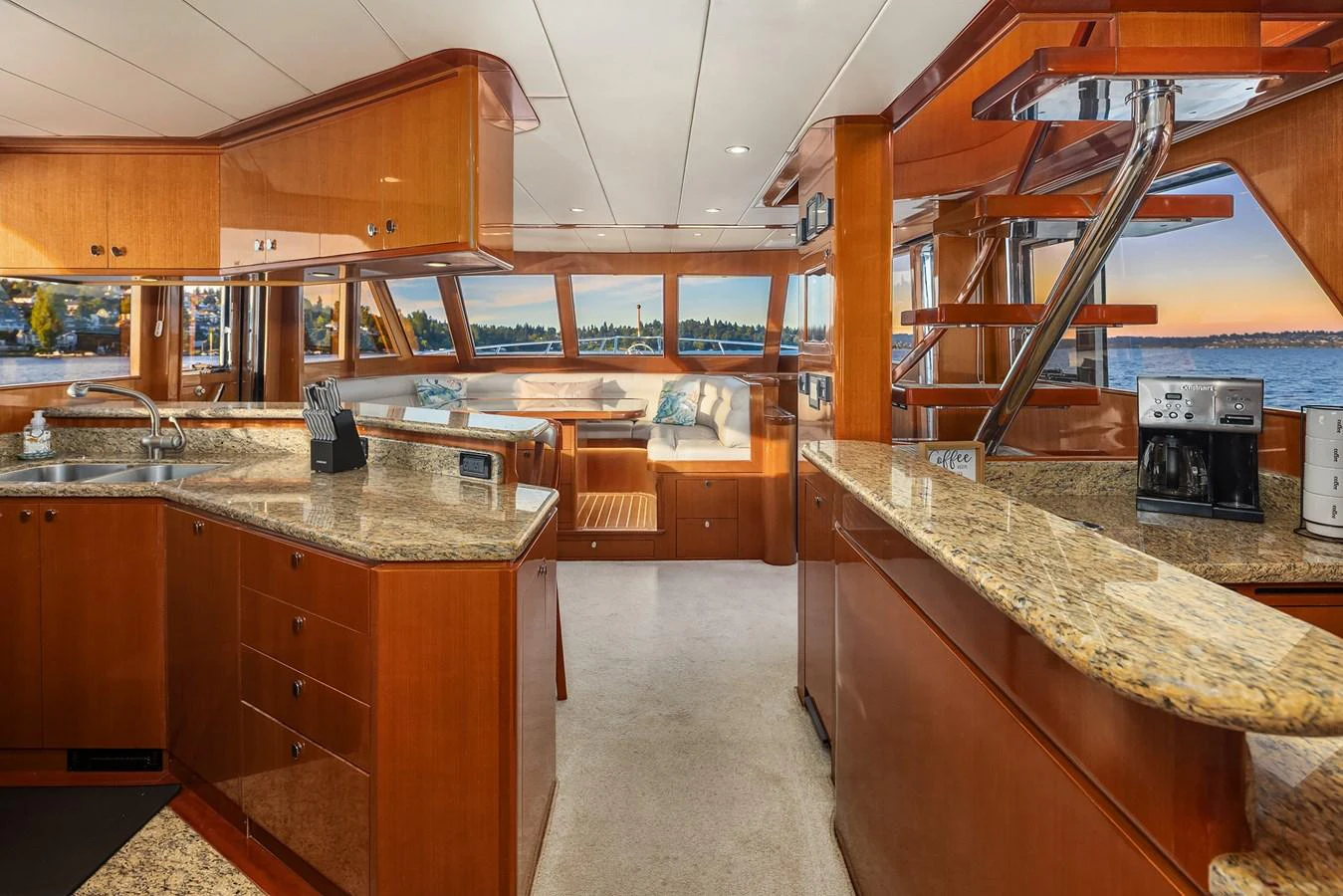 The galley features elegant wood cabinetry and granite countertops with panoramic views. aboard LA BELLA VITA II Yacht for Sale