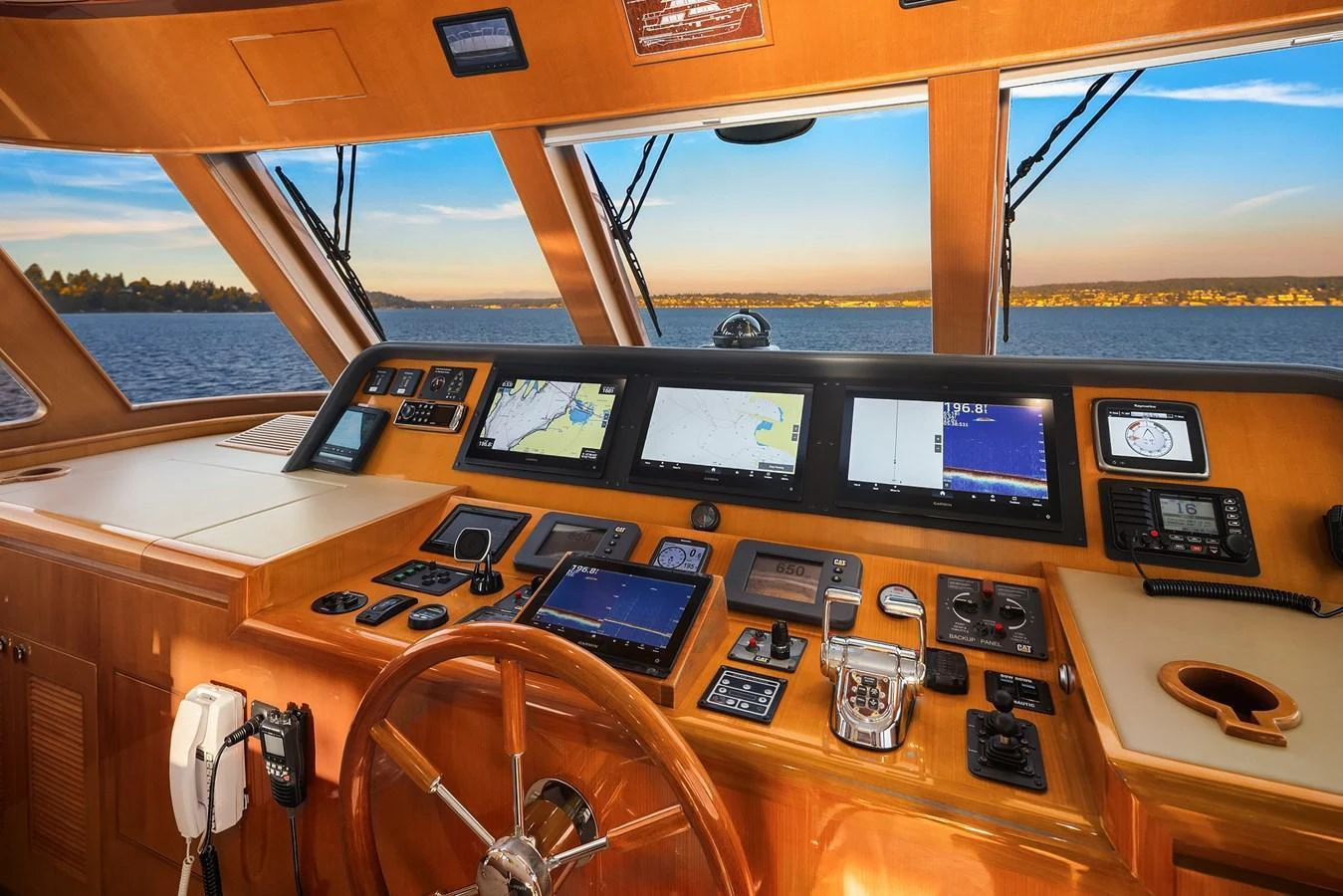 The helm station offers a commanding view with state-of-the-art navigation equipment and luxurious wood finishes. aboard LA BELLA VITA II Yacht for Sale