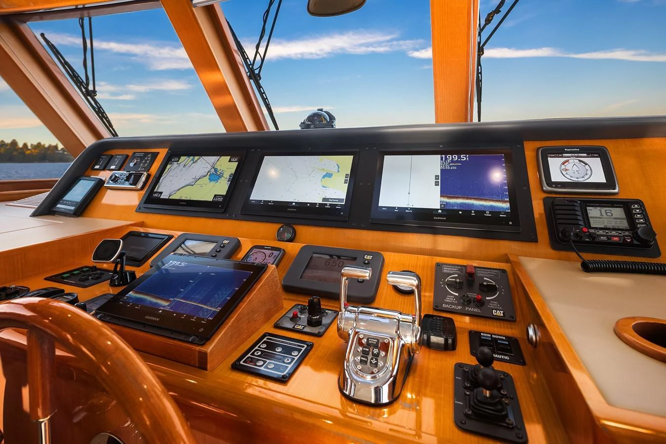 The helm station features advanced navigation equipment and luxurious wood finishes. aboard LA BELLA VITA II Yacht for Sale
