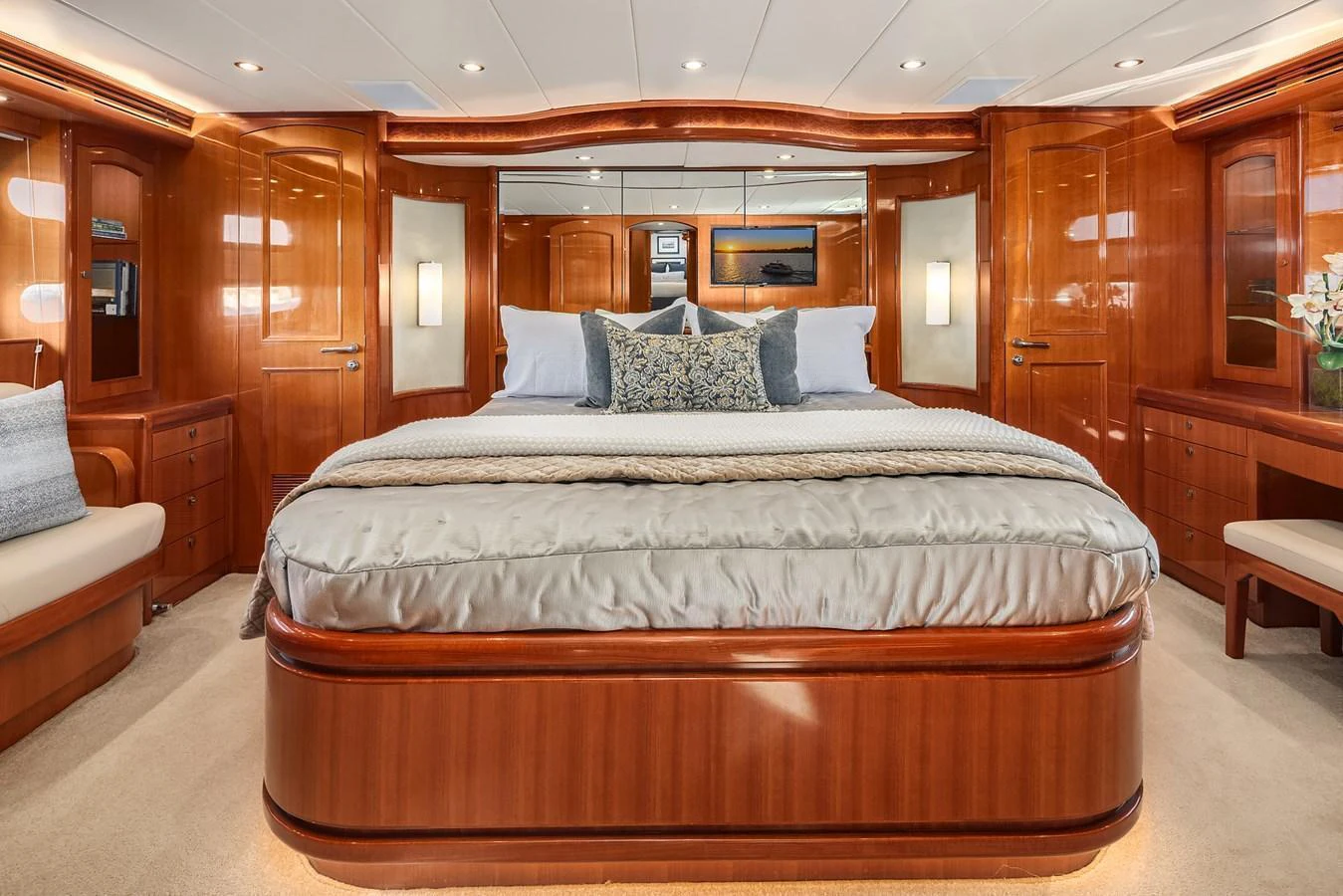 The master stateroom features luxurious wood finishes and a spacious, inviting bed. aboard LA BELLA VITA II Yacht for Sale