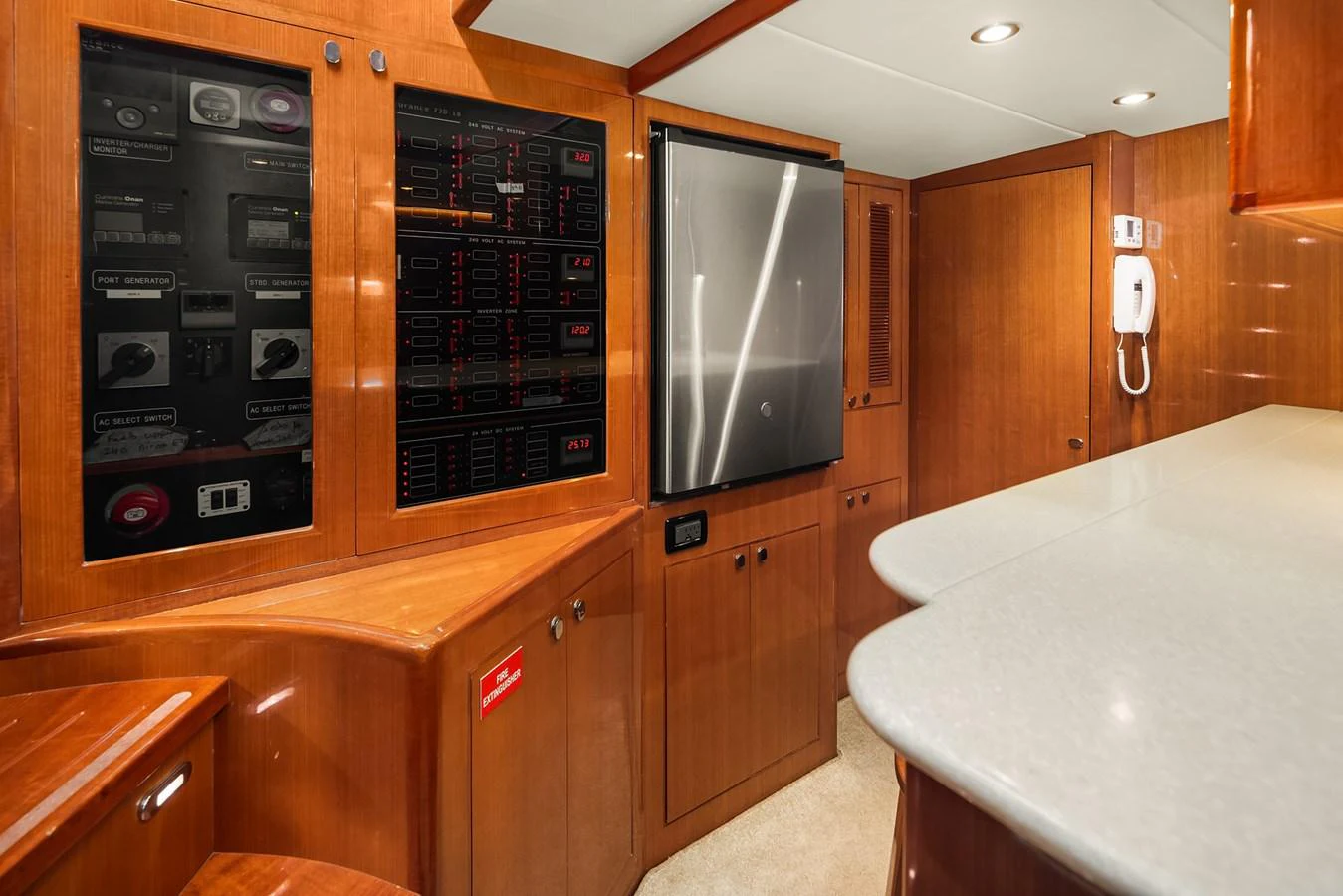 The galley features sleek wooden cabinetry, modern appliances, and ample counter space. aboard LA BELLA VITA II Yacht for Sale