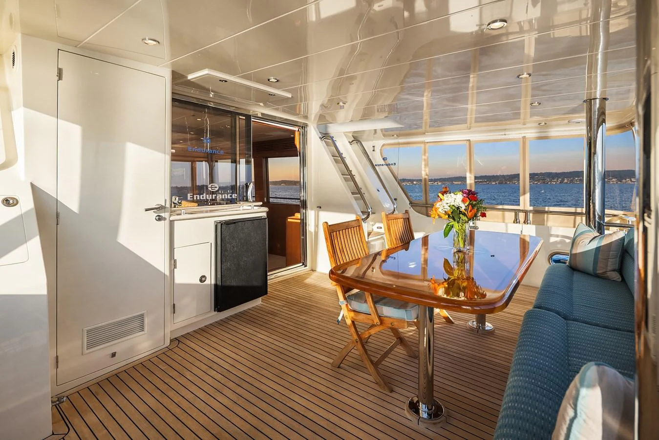 The salon features a spacious and elegant dining area with panoramic views. aboard LA BELLA VITA II Yacht for Sale