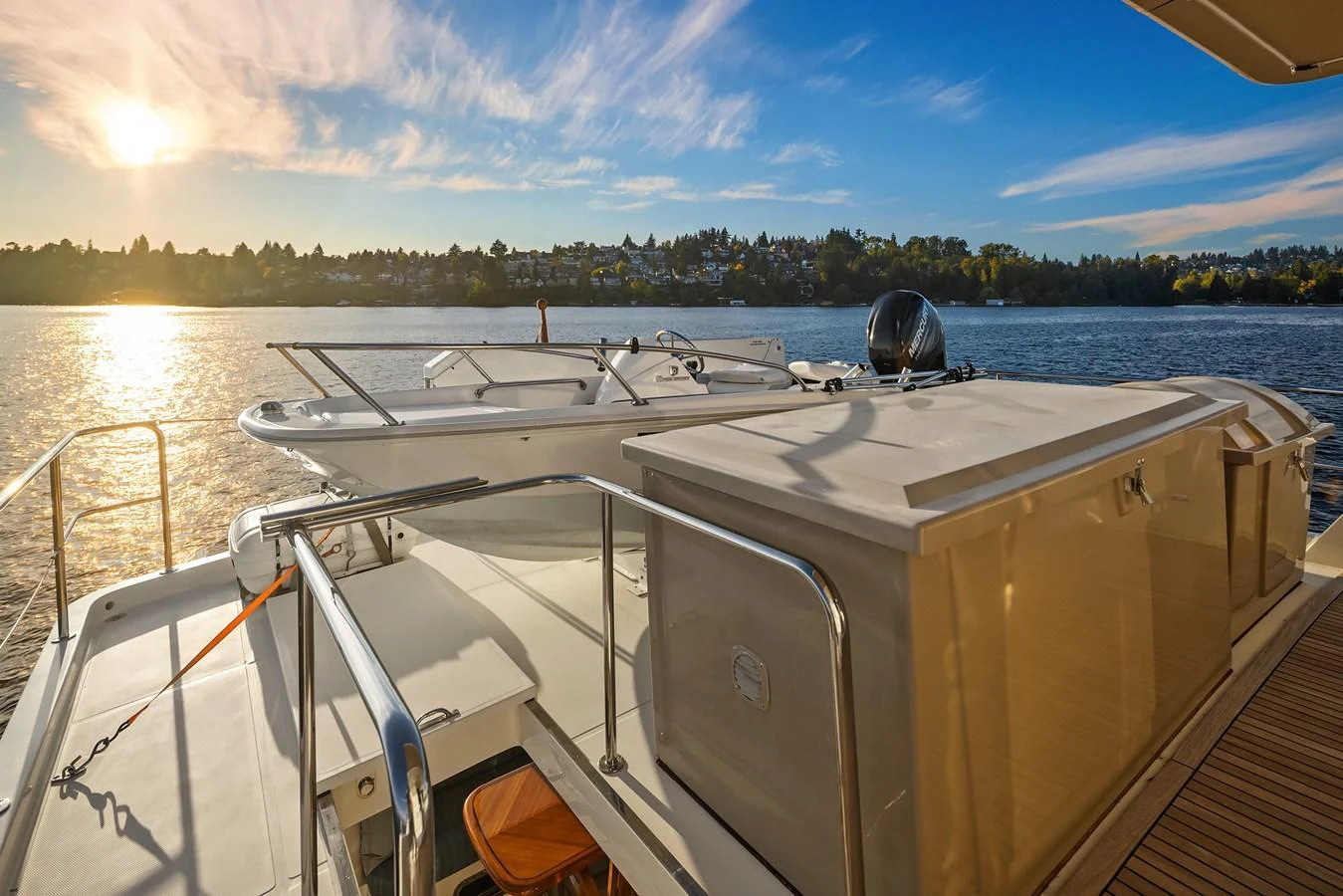 The aft deck offers a serene view of the water with a tender secured on the platform. aboard LA BELLA VITA II Yacht for Sale