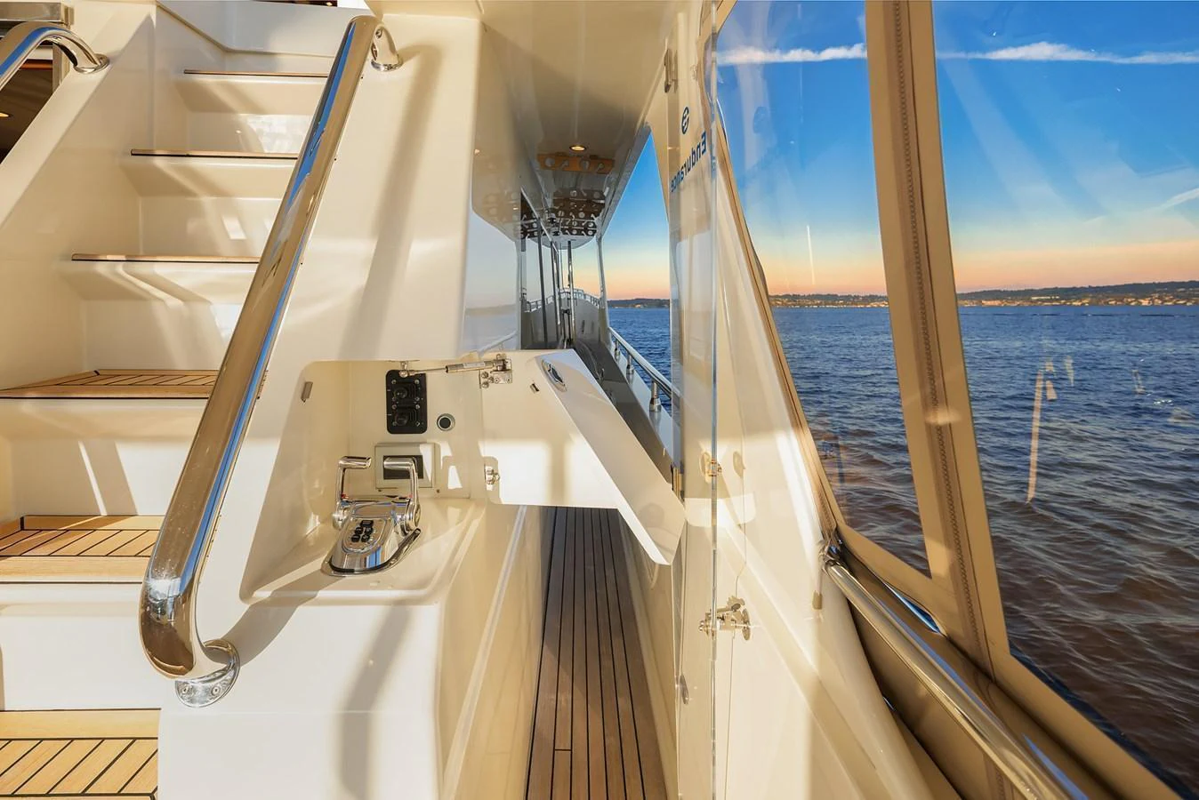 The side deck offers a sleek passage with stunning views of the water. aboard LA BELLA VITA II Yacht for Sale