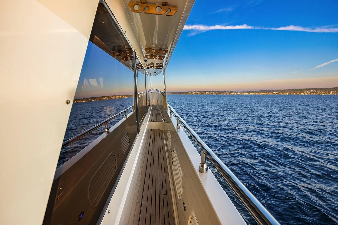 The yacht's side deck offers a serene view of the open water, perfect for a leisurely stroll. aboard LA BELLA VITA II Yacht for Sale