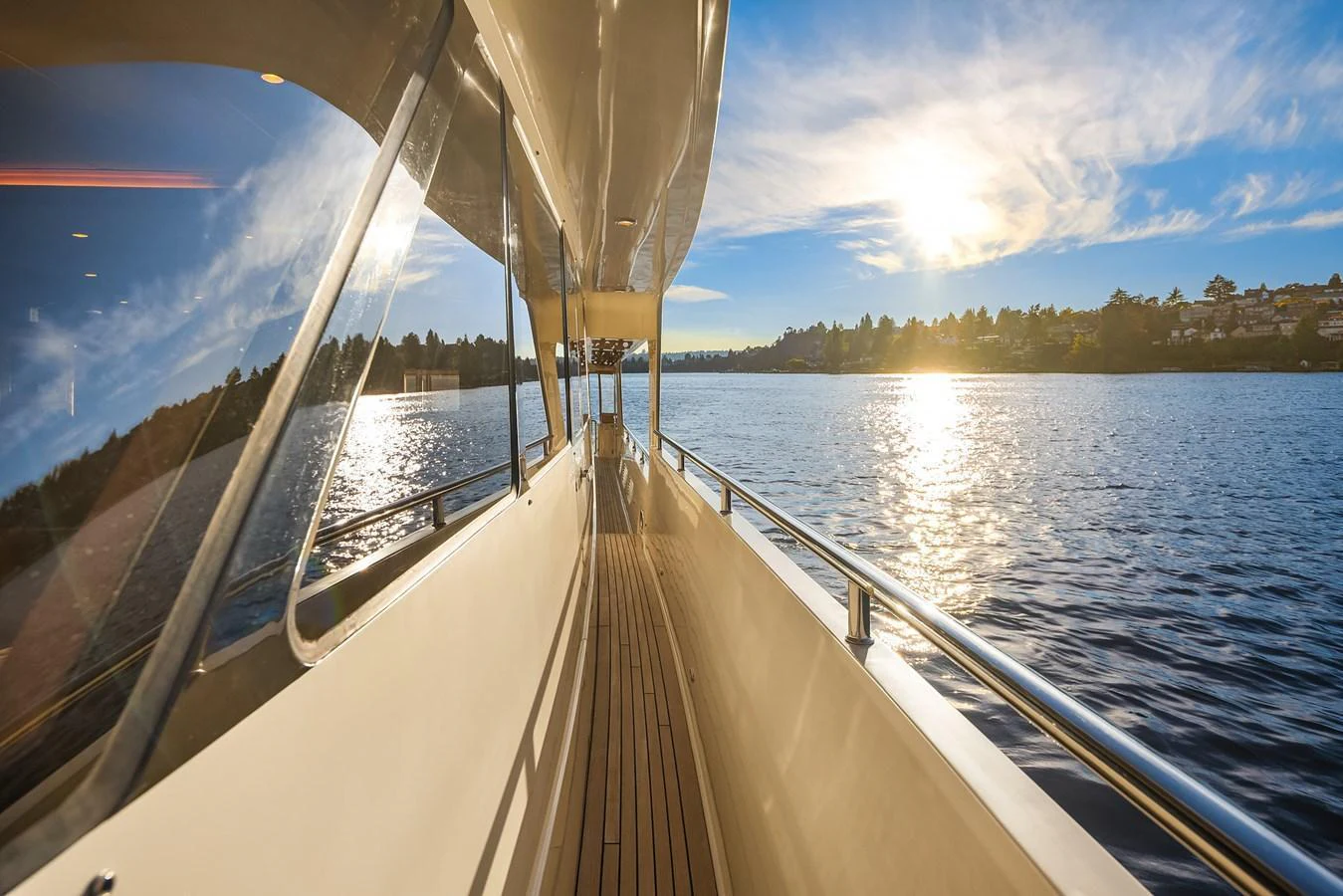 The side deck offers a serene view of the water under a bright, sunny sky. aboard LA BELLA VITA II Yacht for Sale