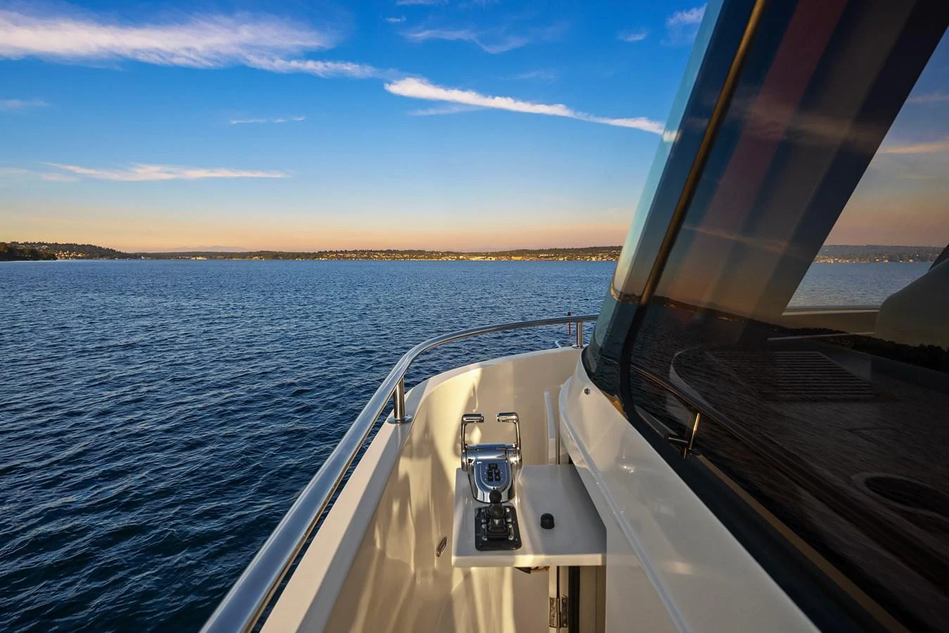 The yacht's bow offers a serene view of the open water under a clear sky. aboard LA BELLA VITA II Yacht for Sale