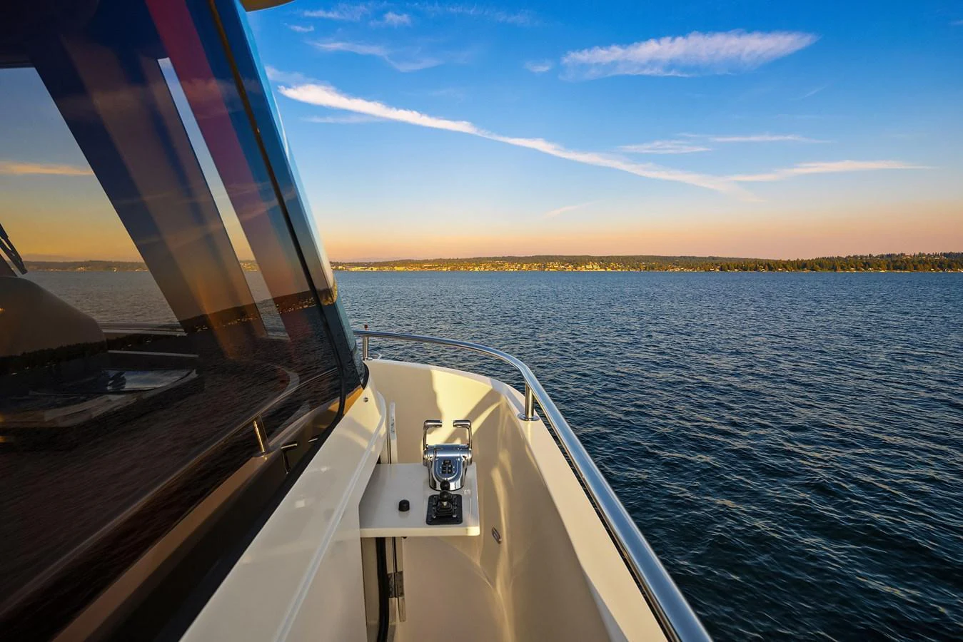 The yacht cruises smoothly on calm waters under a clear sky, offering a serene and picturesque view. aboard LA BELLA VITA II Yacht for Sale