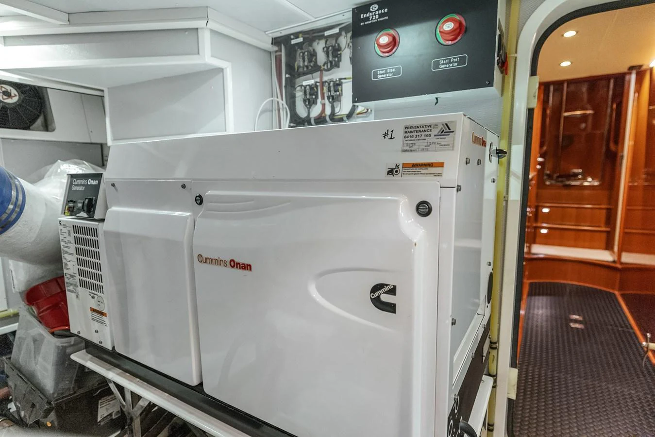 The image showcases the yacht's engine room featuring a Cummins Onan generator. aboard LA BELLA VITA II Yacht for Sale