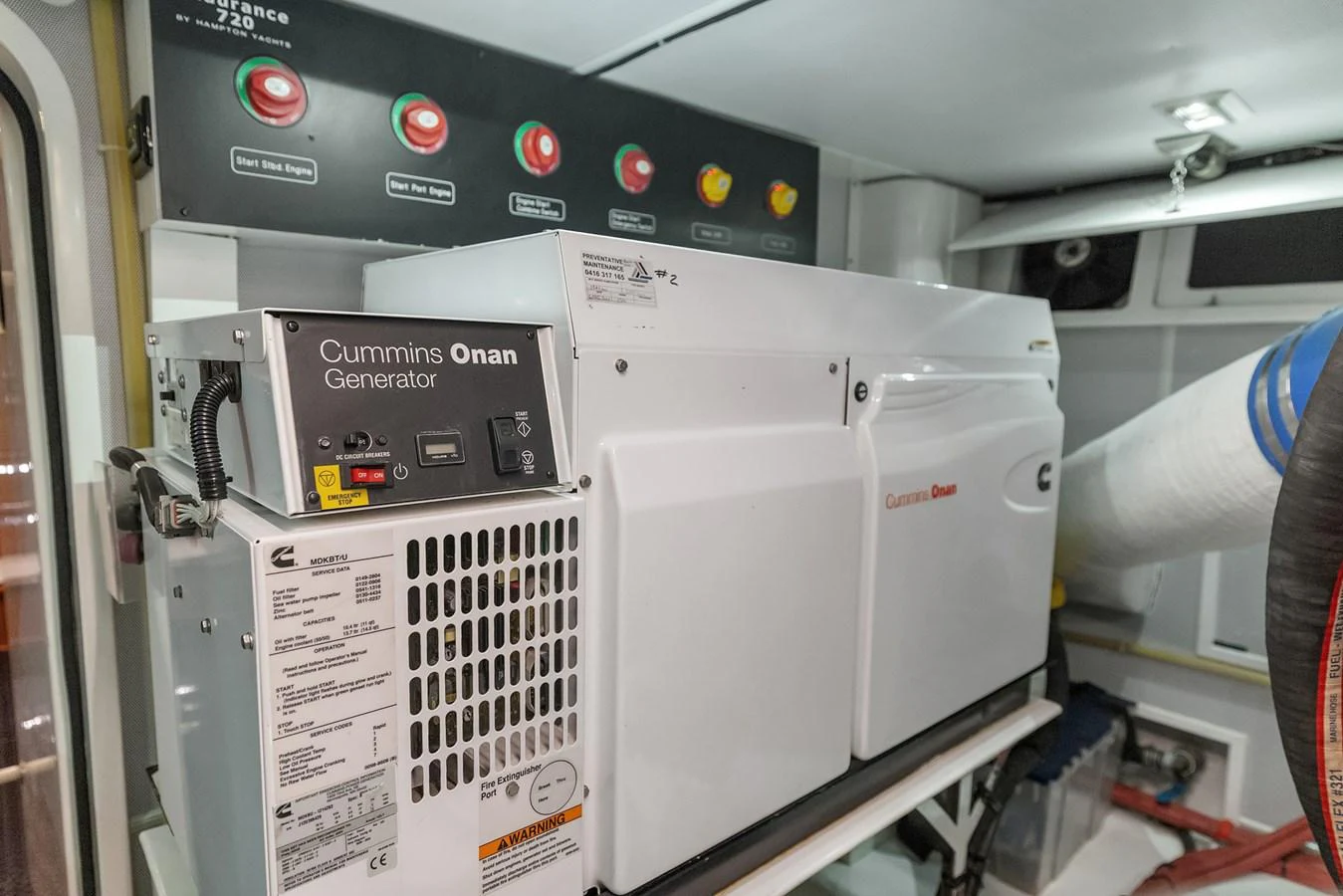 The image showcases a Cummins Onan generator in the yacht's engine room. aboard LA BELLA VITA II Yacht for Sale