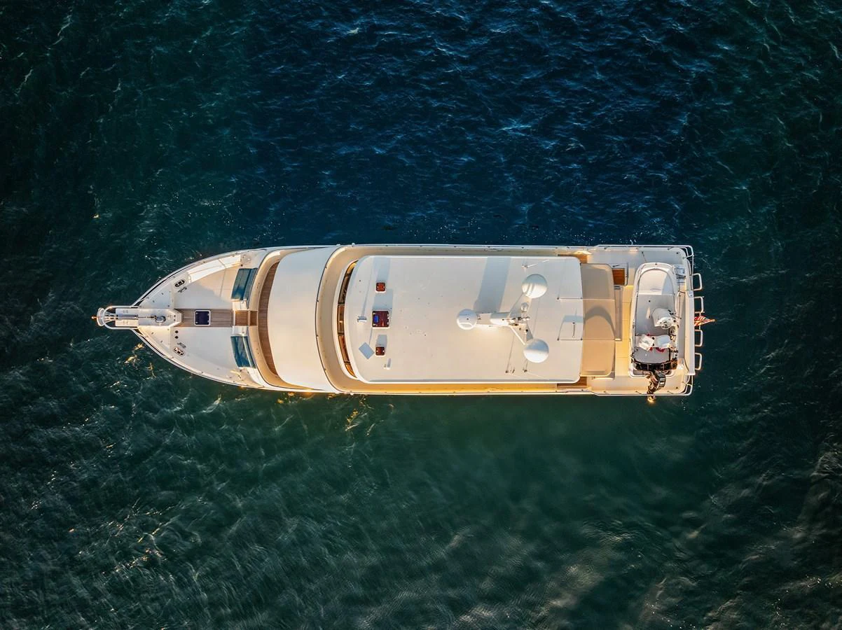 A stunning aerial view of a luxurious yacht cruising on the open water. aboard LA BELLA VITA II Yacht for Sale