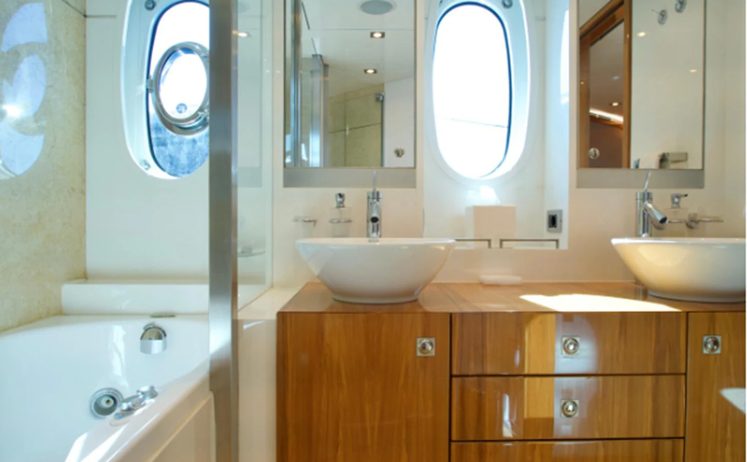 The yacht's bathroom features a modern design with dual sinks and ample natural light. aboard SEA BREEZE ONE Yacht for Sale