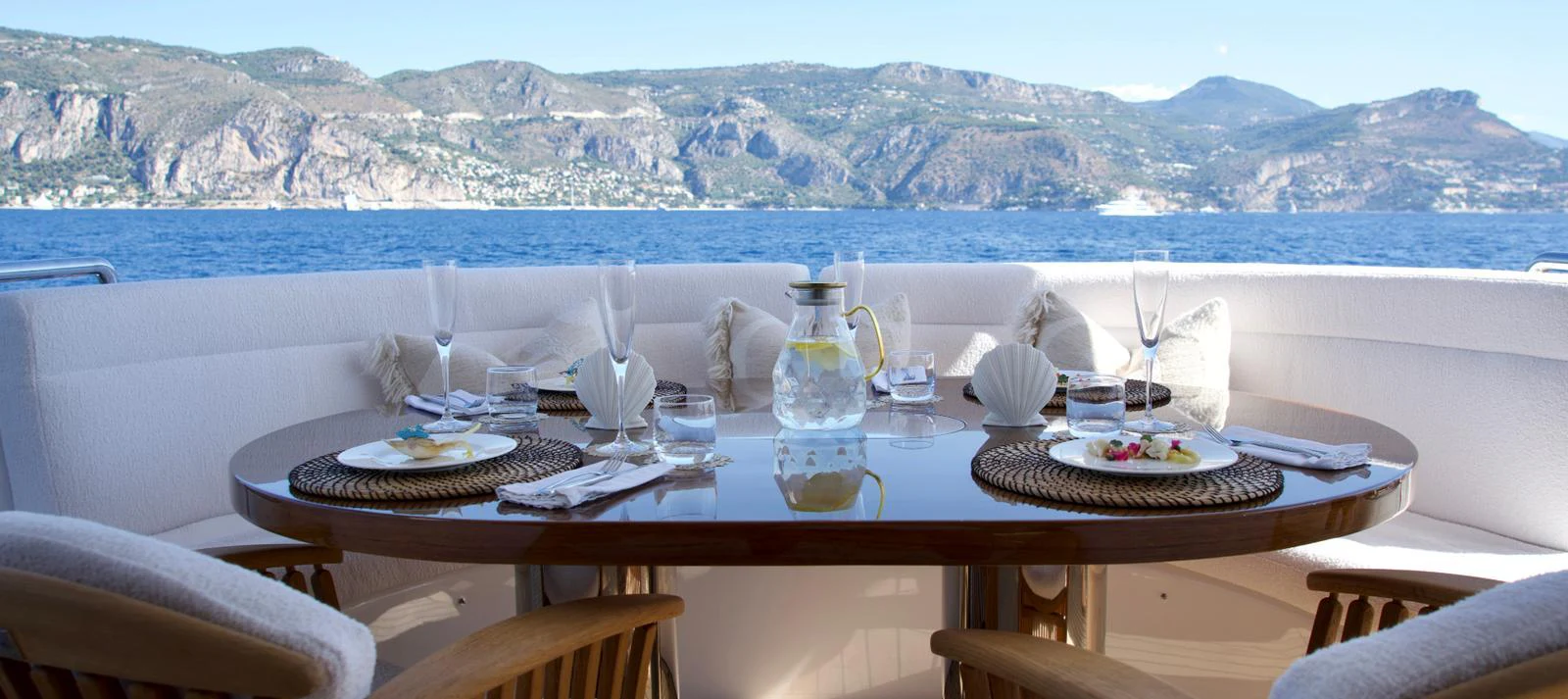 An elegant dining area on the aft deck offers stunning views of the surrounding landscape. aboard SEA BREEZE ONE Yacht for Sale