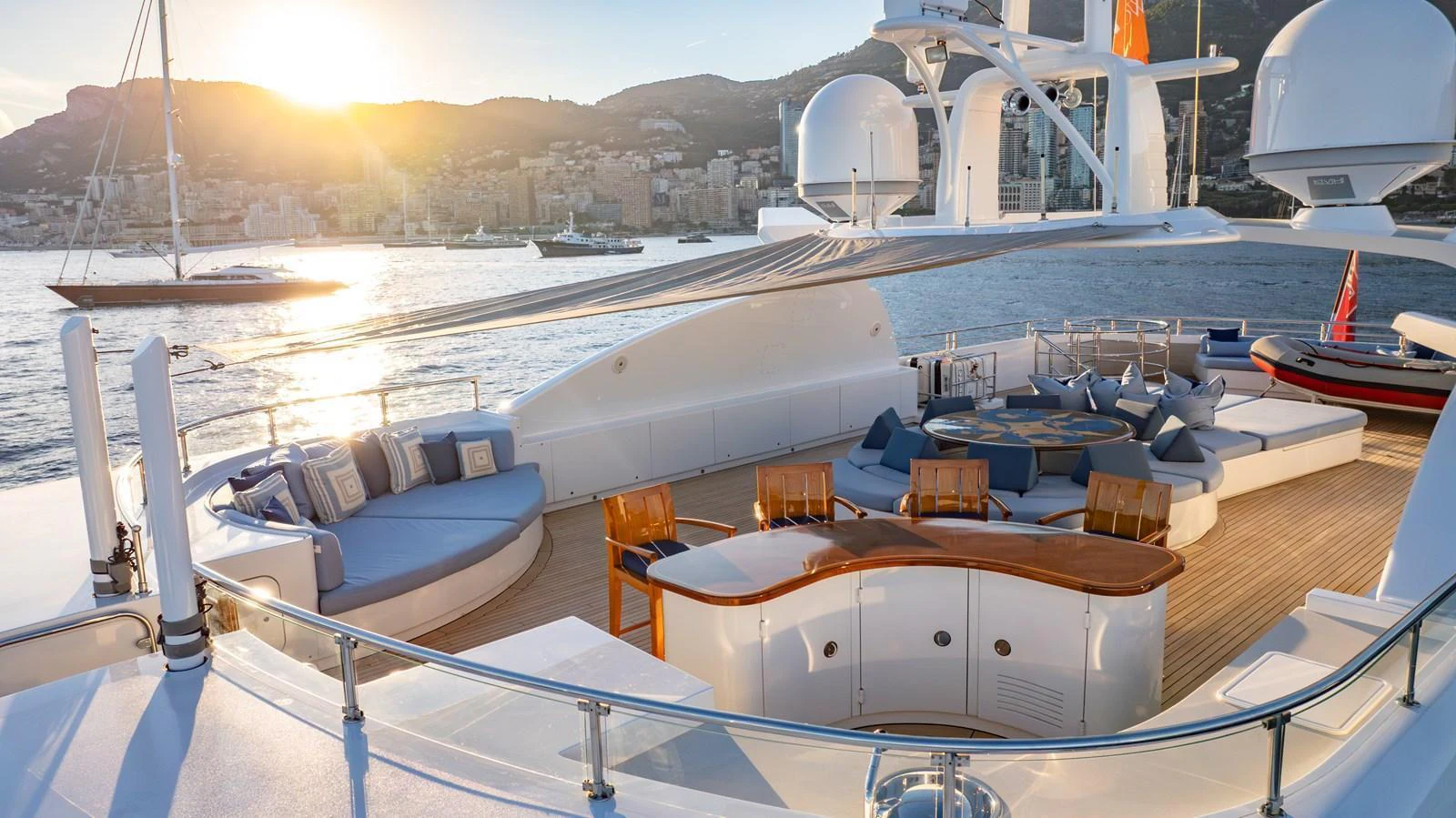 The aft deck offers a luxurious outdoor seating area with stunning views of the water and surrounding landscape. aboard LATITUDE Yacht for Sale