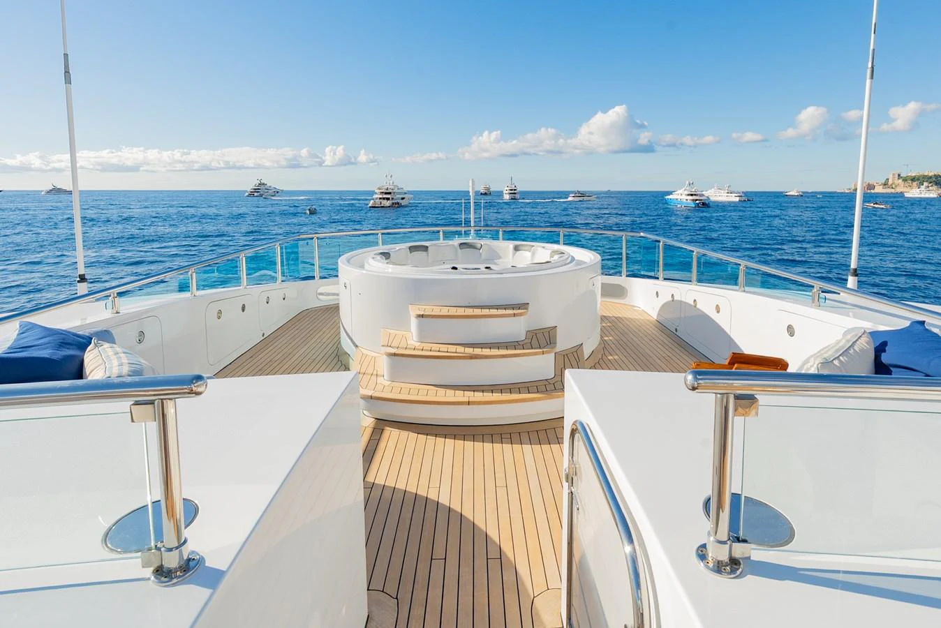 The sundeck features a luxurious jacuzzi with ample seating and stunning ocean views. aboard LATITUDE Yacht for Sale