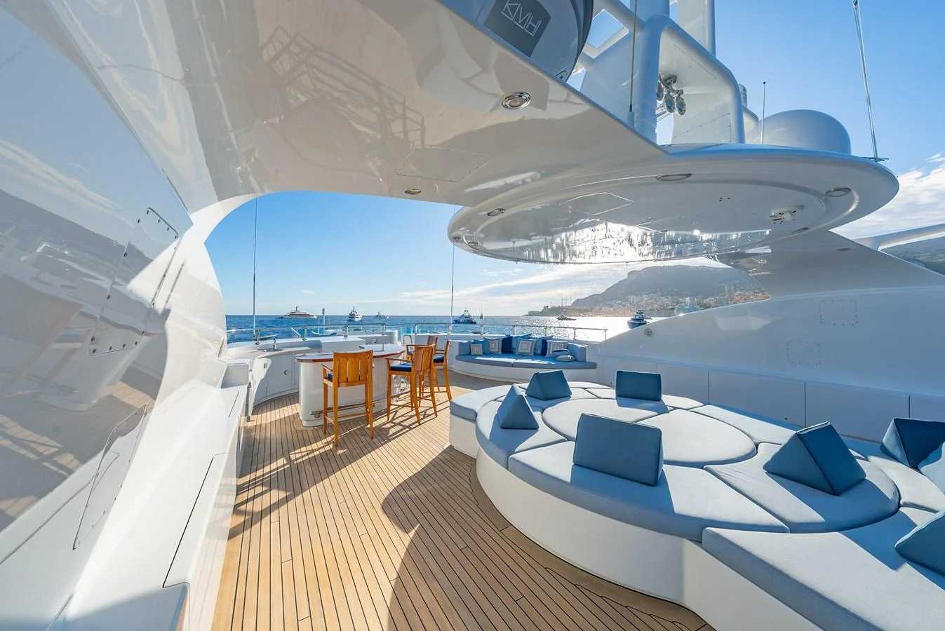 The sundeck offers luxurious seating and dining areas with stunning ocean views. aboard LATITUDE Yacht for Sale