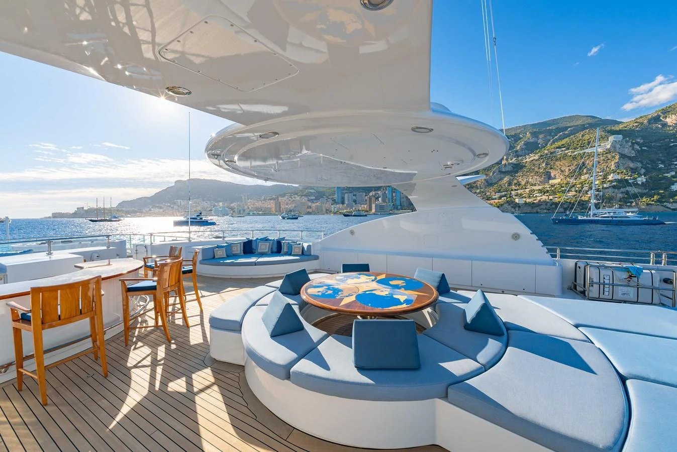 The sundeck offers a luxurious lounging area with panoramic views of the sea and surrounding landscape. aboard LATITUDE Yacht for Sale