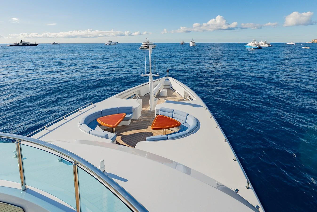 The yacht's bow offers a spacious and inviting area with comfortable seating and stunning ocean views. aboard LATITUDE Yacht for Sale