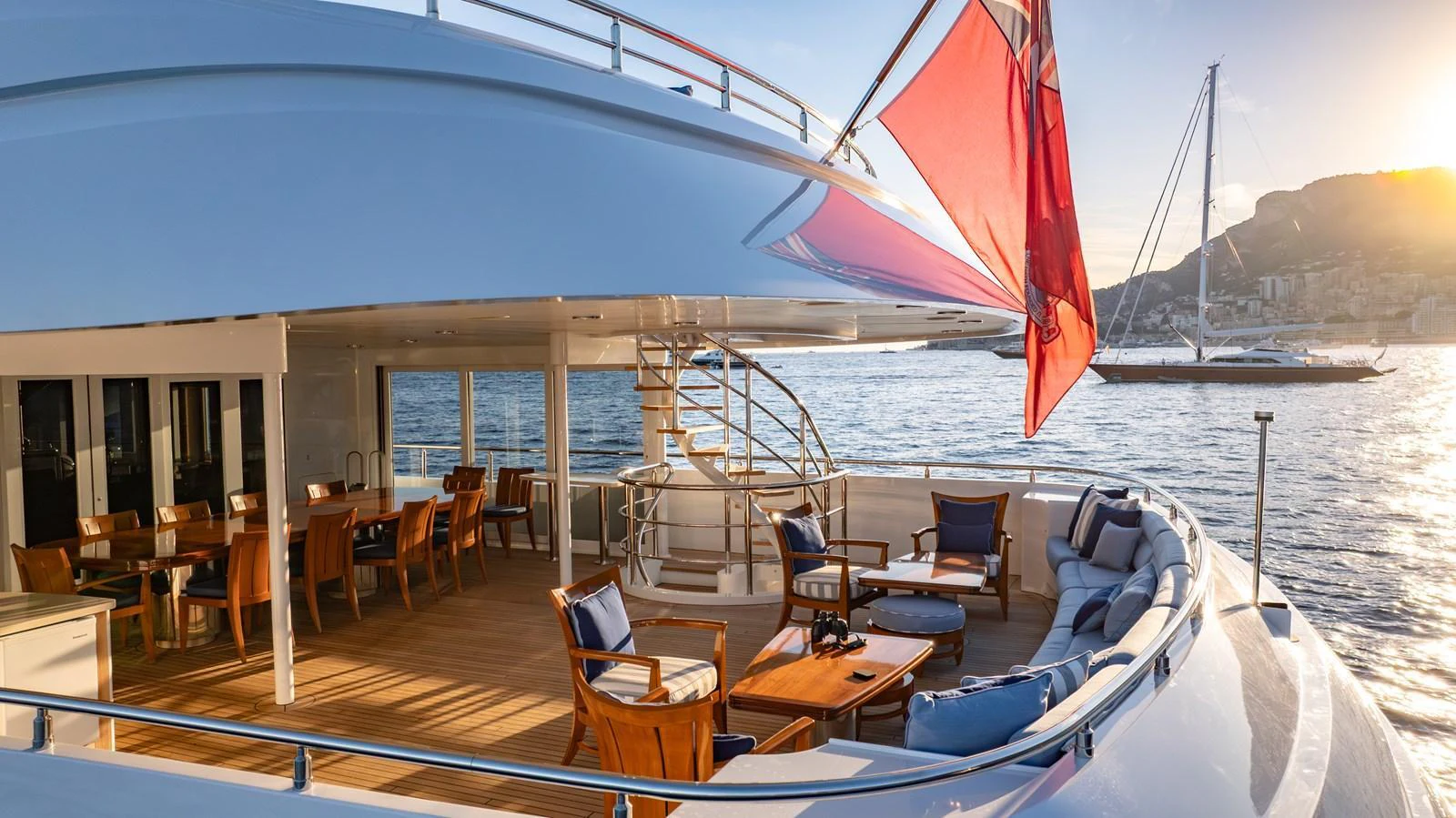 The aft deck offers a spacious and inviting area for relaxation and dining with stunning views of the water. aboard LATITUDE Yacht for Sale