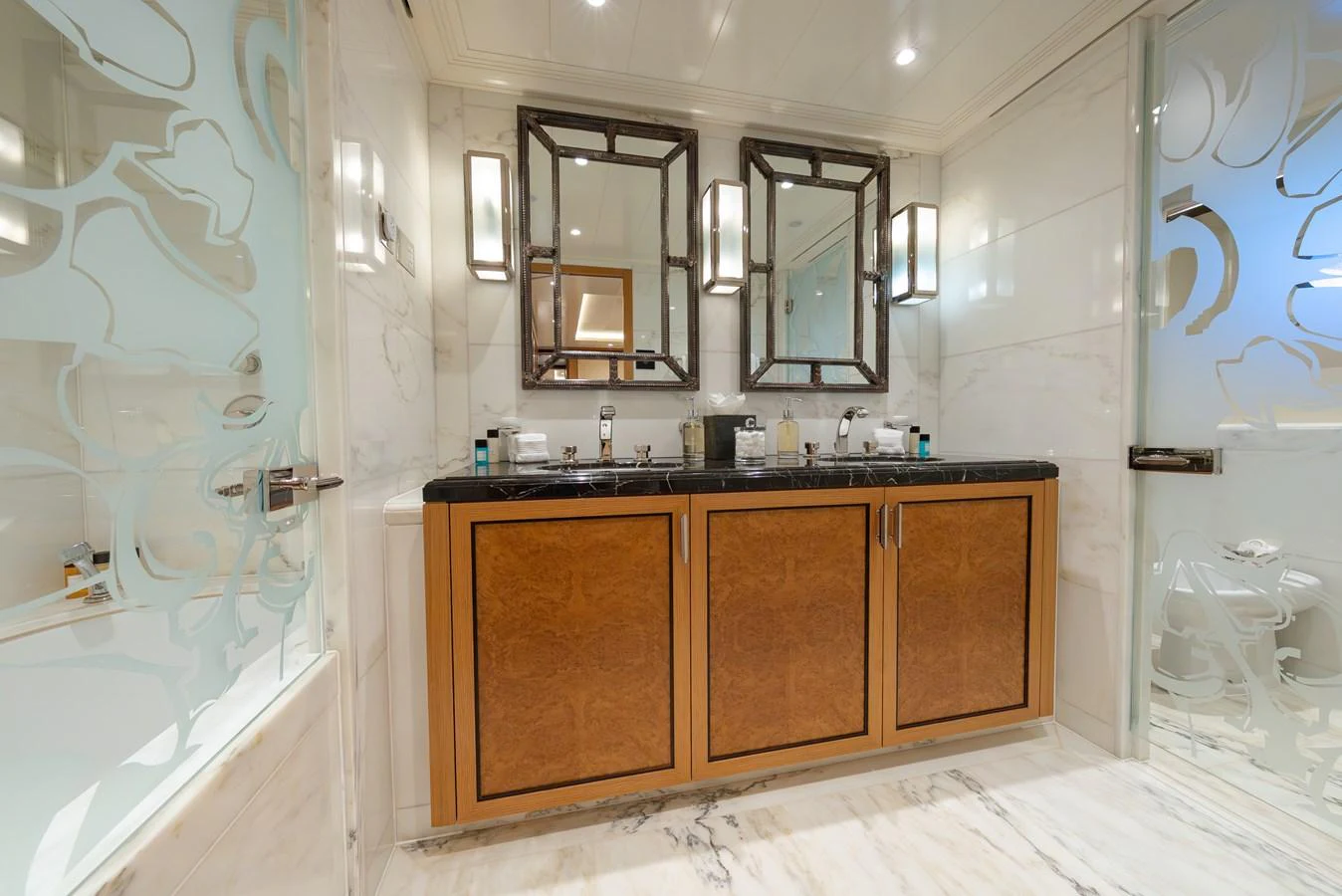 The yacht's bathroom features elegant fixtures and a luxurious design with marble accents. aboard LATITUDE Yacht for Sale