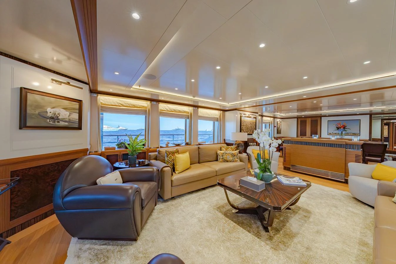 The yacht's salon offers a spacious and luxurious seating area with elegant decor and ample natural light. aboard LATITUDE Yacht for Sale