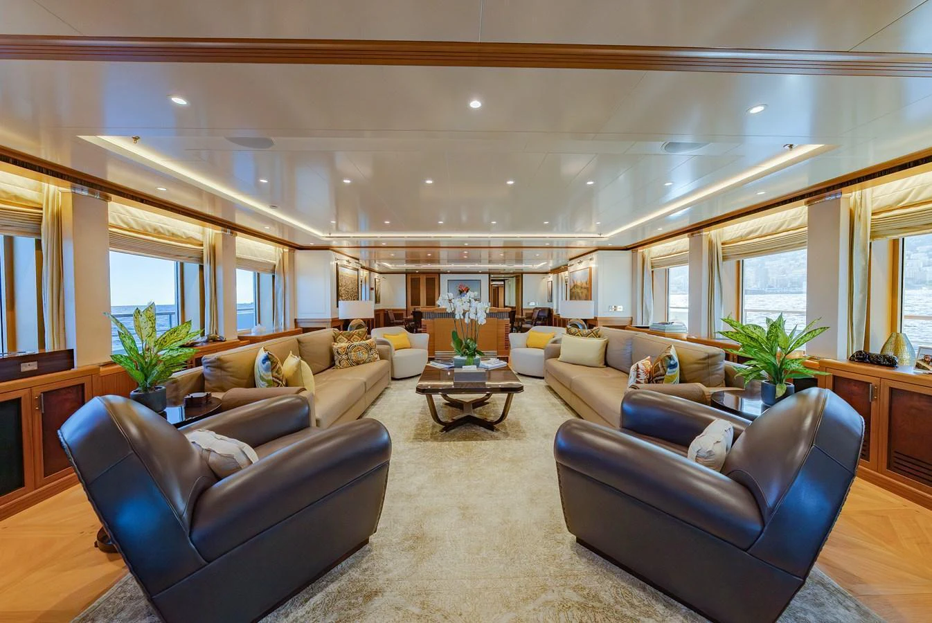 The spacious salon features luxurious seating and elegant decor, perfect for relaxation and entertainment. aboard LATITUDE Yacht for Sale