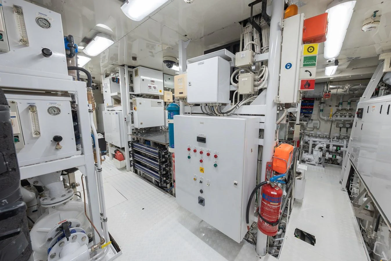 The engine room is equipped with advanced machinery and safety equipment, ensuring optimal performance and safety. aboard LATITUDE Yacht for Sale