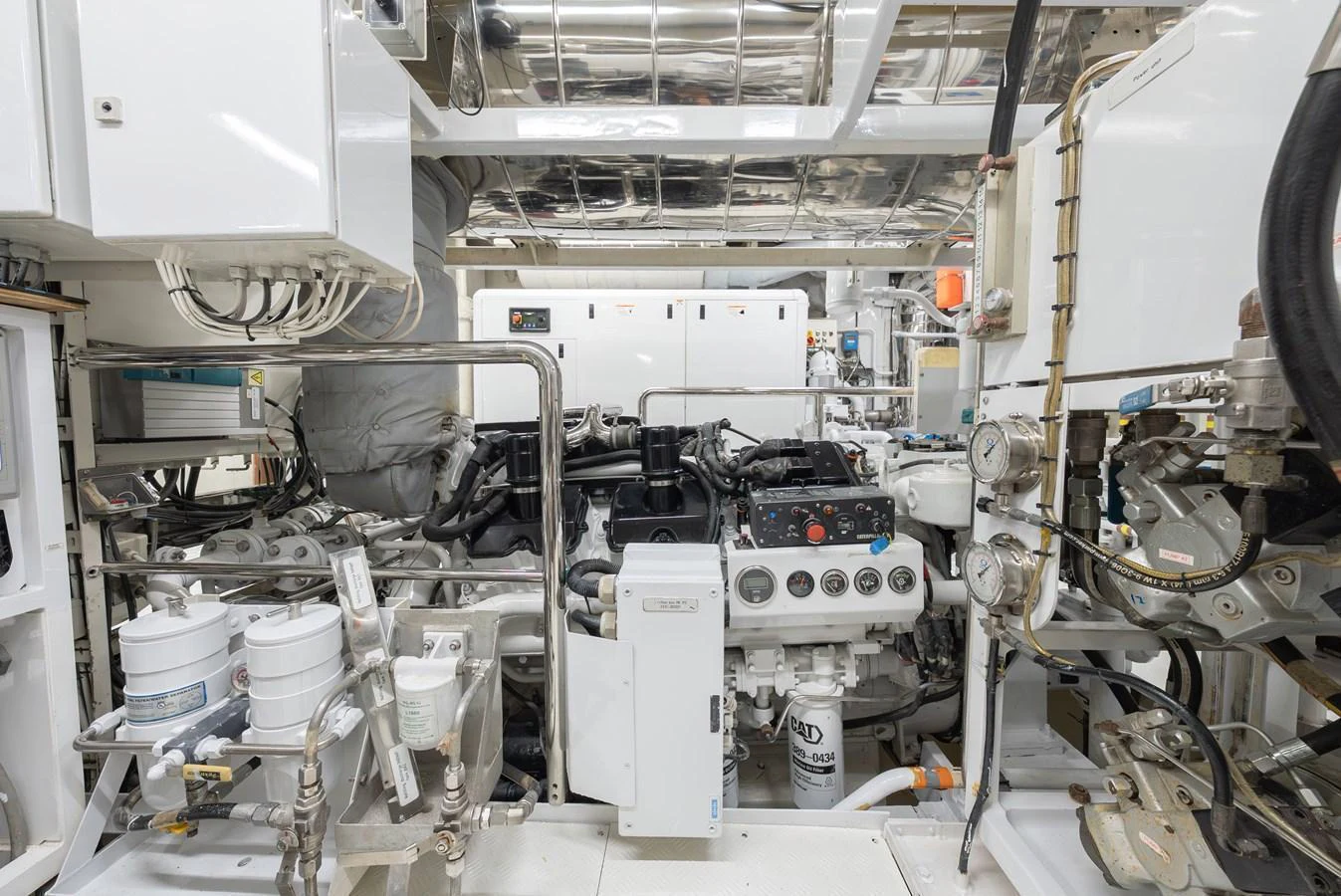 The image showcases the yacht's well-maintained engine room with advanced machinery and equipment. aboard LATITUDE Yacht for Sale
