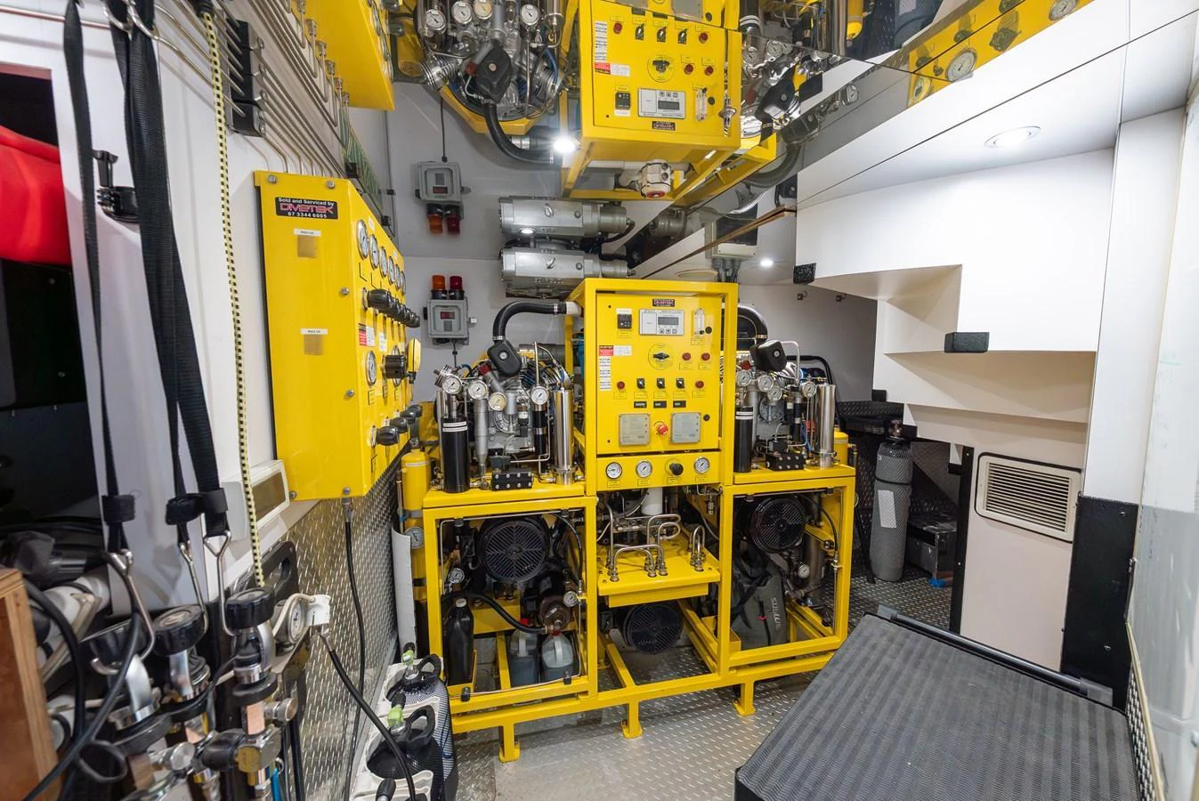 The image showcases the well-organized and advanced engine room of the yacht. aboard LATITUDE Yacht for Sale